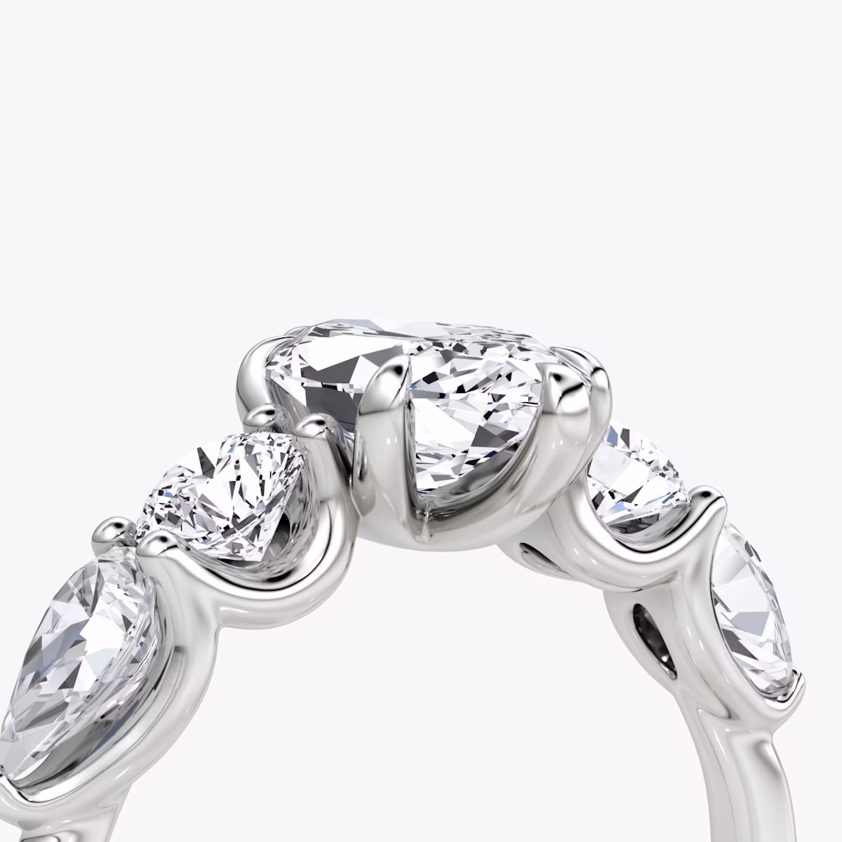 The Mixed Shape | Marquise | Platinum | bandAccent: Plain | sideStoneOrientation: horizontal | sideStoneShape: Round Brilliant and Pear | diamondOrientation: vertical | caratWeight: other