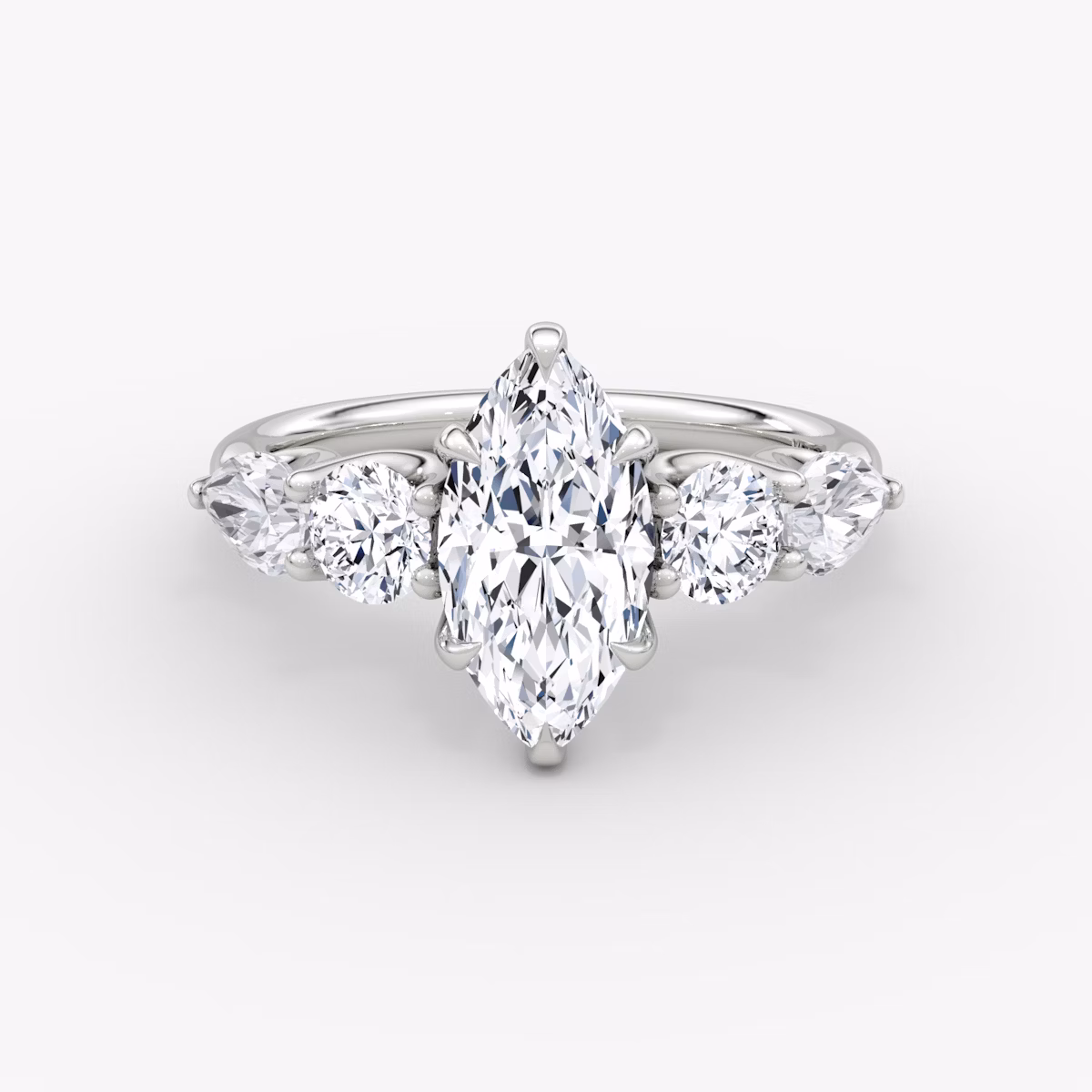 The Mixed Shape | Marquise | Platinum | bandAccent: Plain | sideStoneOrientation: horizontal | sideStoneShape: Round Brilliant and Pear | diamondOrientation: vertical | caratWeight: other