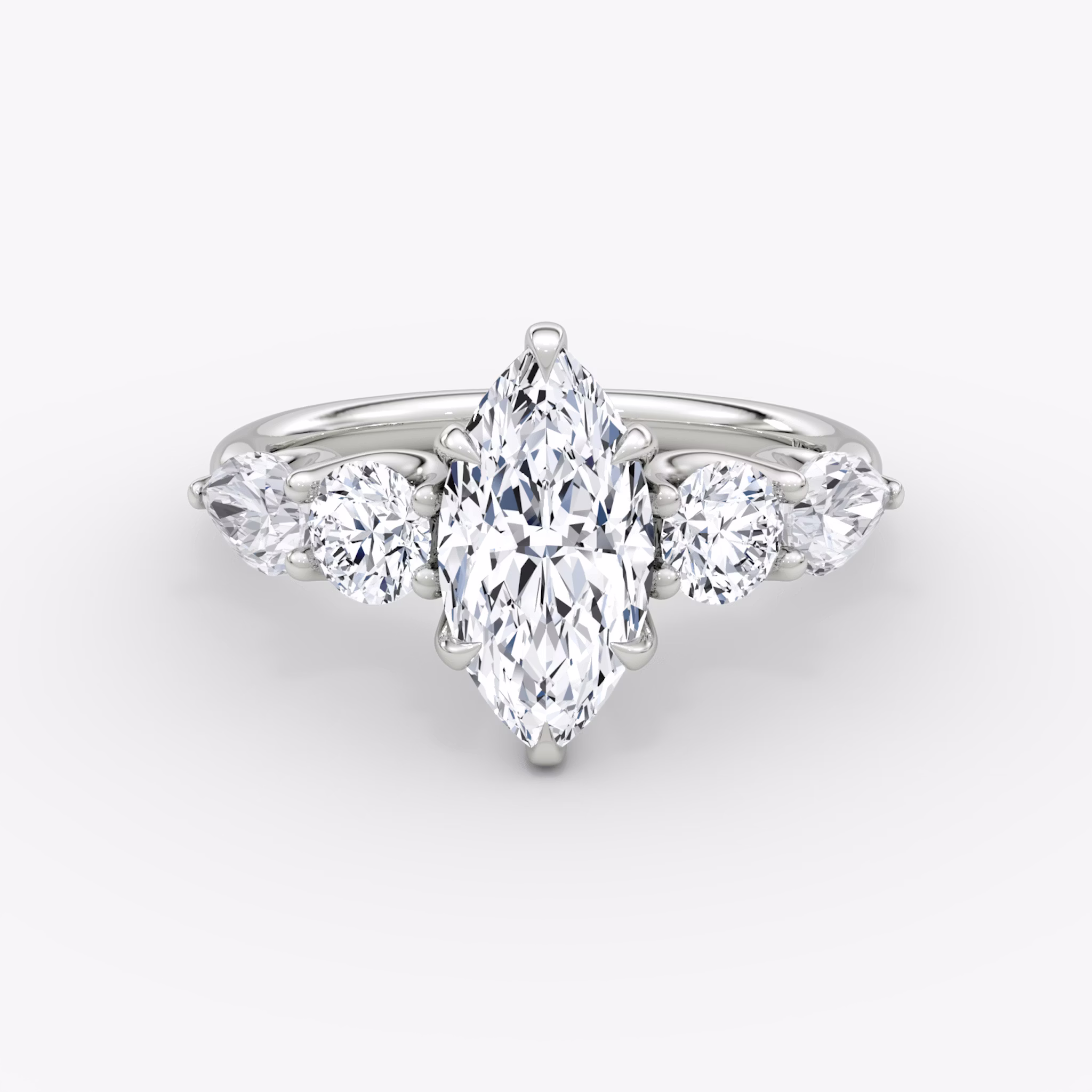 The Mixed Shape | Marquise | 18k | White Gold | bandAccent: Plain | sideStoneOrientation: horizontal | sideStoneShape: Round Brilliant and Pear | diamondOrientation: vertical | caratWeight: other