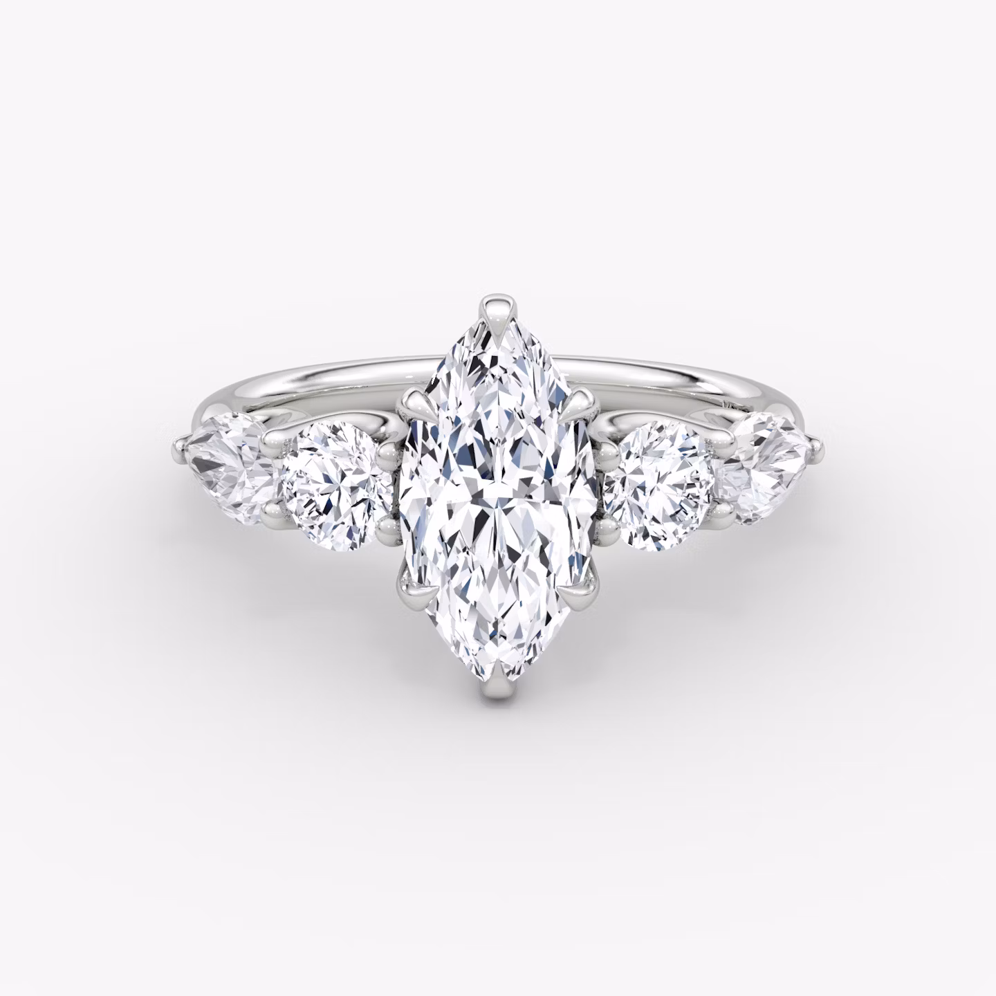 The Mixed Shape | Marquise | 18k | White Gold | bandAccent: Plain | sideStoneOrientation: horizontal | sideStoneShape: Round Brilliant and Pear | diamondOrientation: vertical | caratWeight: other