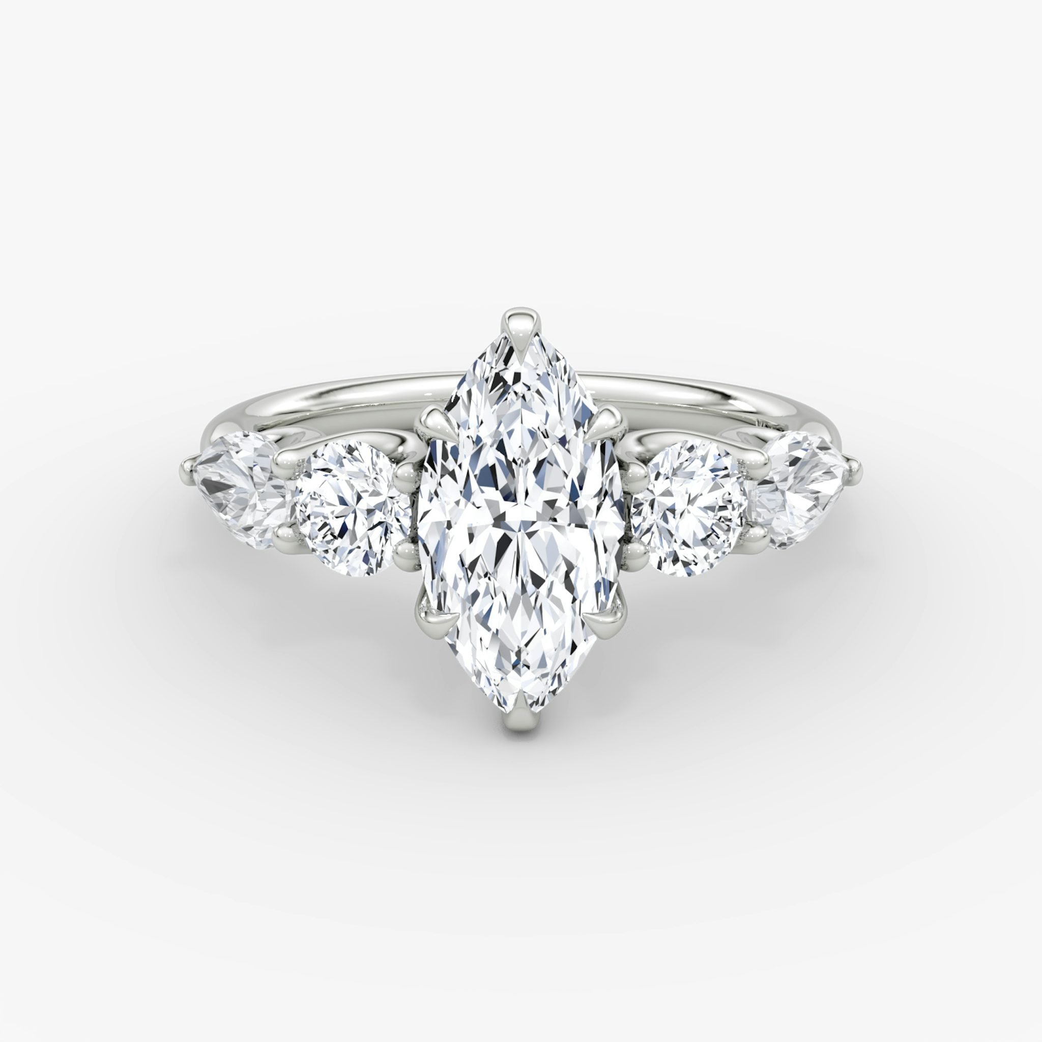 The Mixed Shape | Marquise | 18k | White Gold | bandAccent: Plain | sideStoneOrientation: horizontal | sideStoneShape: Round Brilliant and Pear | diamondOrientation: vertical | caratWeight: other