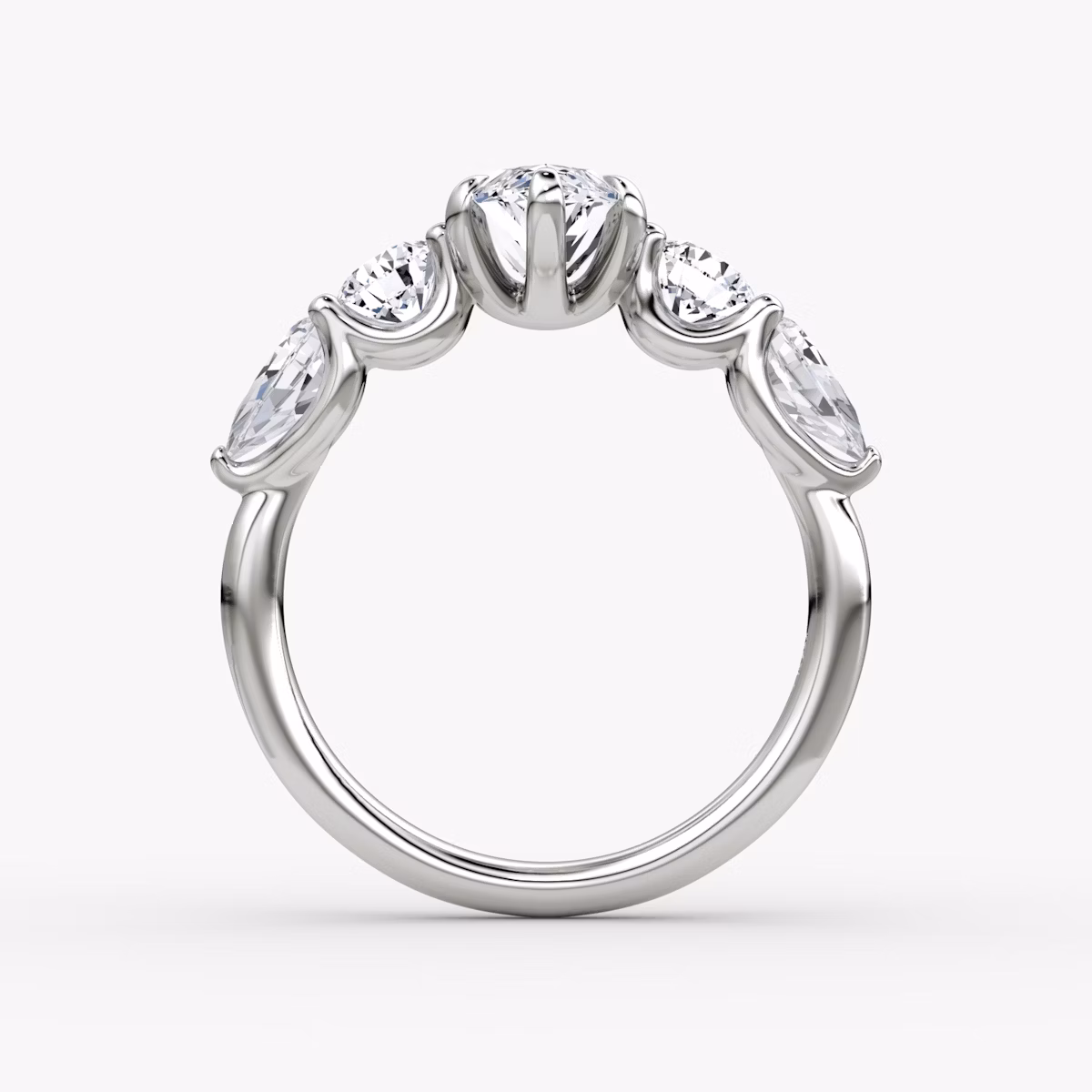 The Mixed Shape | Marquise | Platinum | bandAccent: Plain | sideStoneOrientation: horizontal | sideStoneShape: Round Brilliant and Pear | diamondOrientation: vertical | caratWeight: other