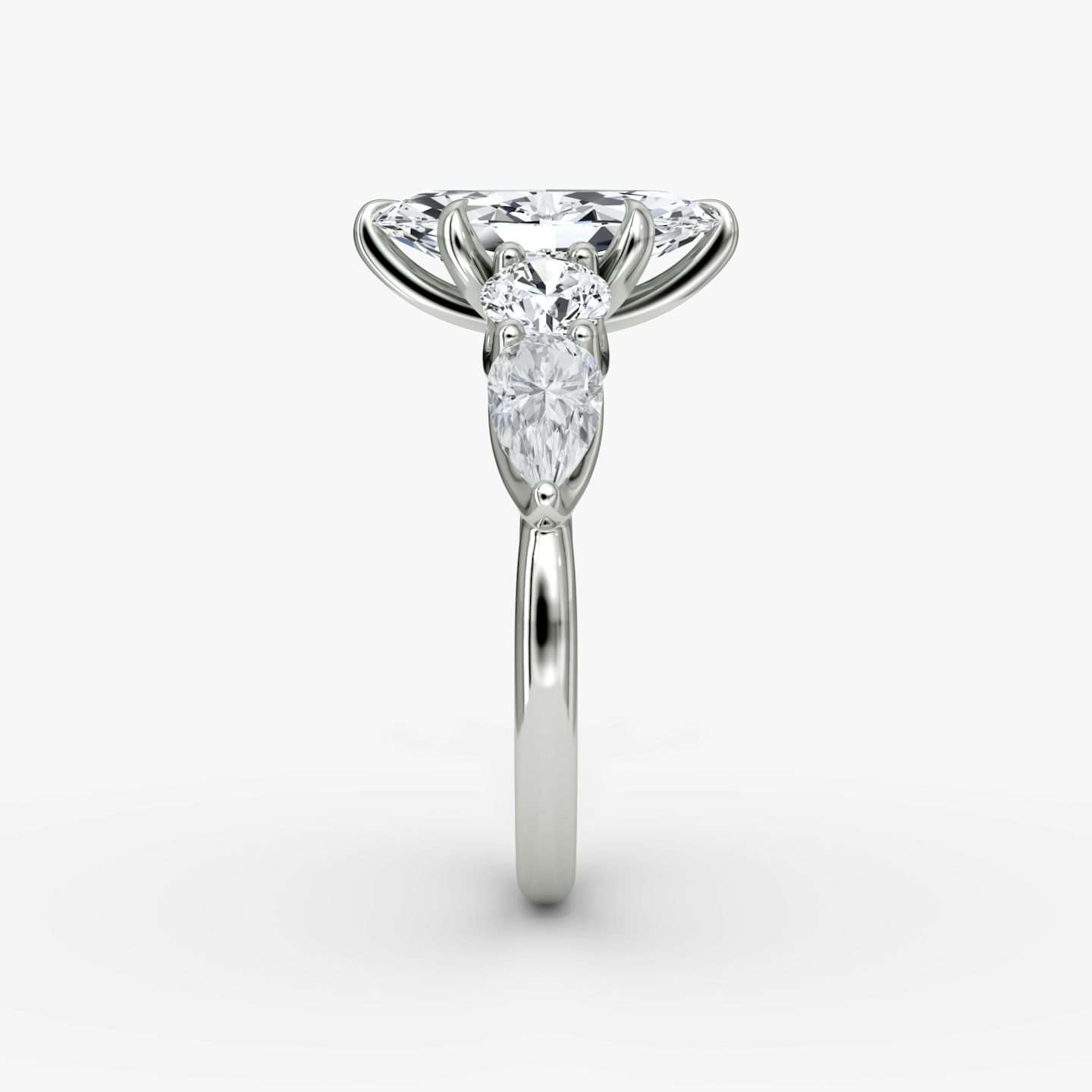 The Mixed Shape | Marquise | 18k | White Gold | bandAccent: Plain | sideStoneOrientation: horizontal | sideStoneShape: Round Brilliant and Pear | diamondOrientation: vertical | caratWeight: other