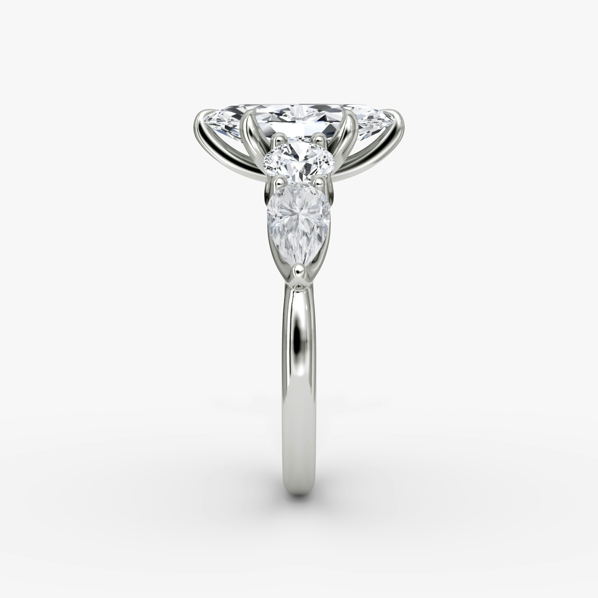 The Mixed Shape | Marquise | 18k | White Gold | bandAccent: Plain | sideStoneOrientation: horizontal | sideStoneShape: Round Brilliant and Pear | diamondOrientation: vertical | caratWeight: other