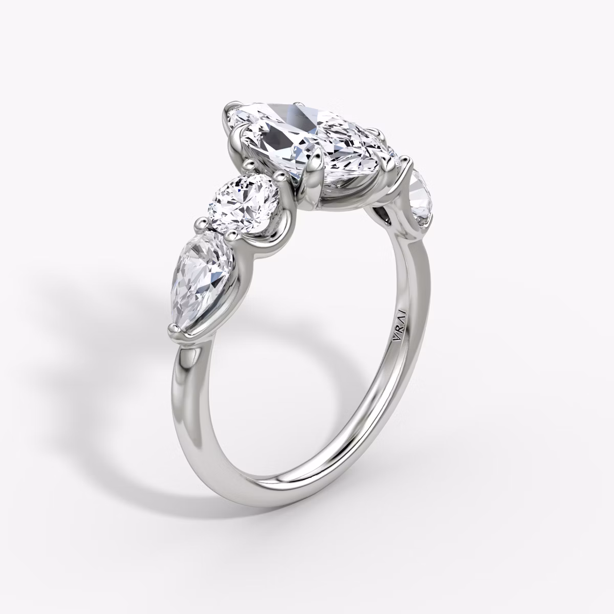 The Mixed Shape | Marquise | Platinum | bandAccent: Plain | sideStoneOrientation: horizontal | sideStoneShape: Round Brilliant and Pear | diamondOrientation: vertical | caratWeight: other