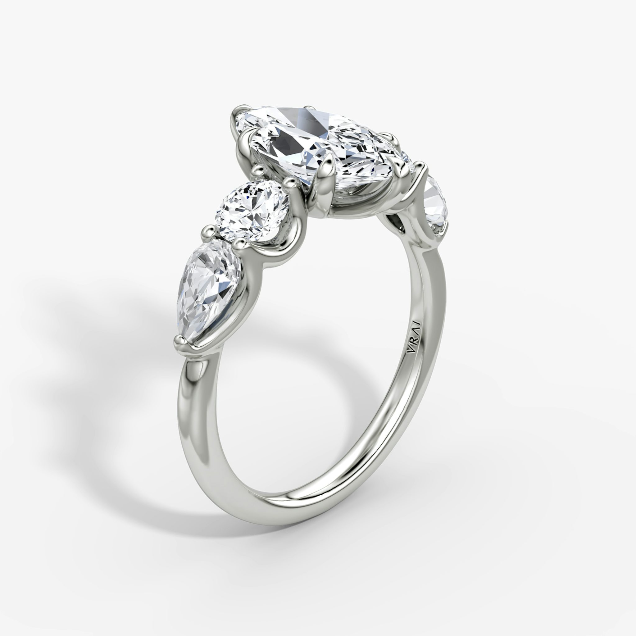 The Mixed Shape | Marquise | 18k | White Gold | bandAccent: Plain | sideStoneOrientation: horizontal | sideStoneShape: Round Brilliant and Pear | diamondOrientation: vertical | caratWeight: other