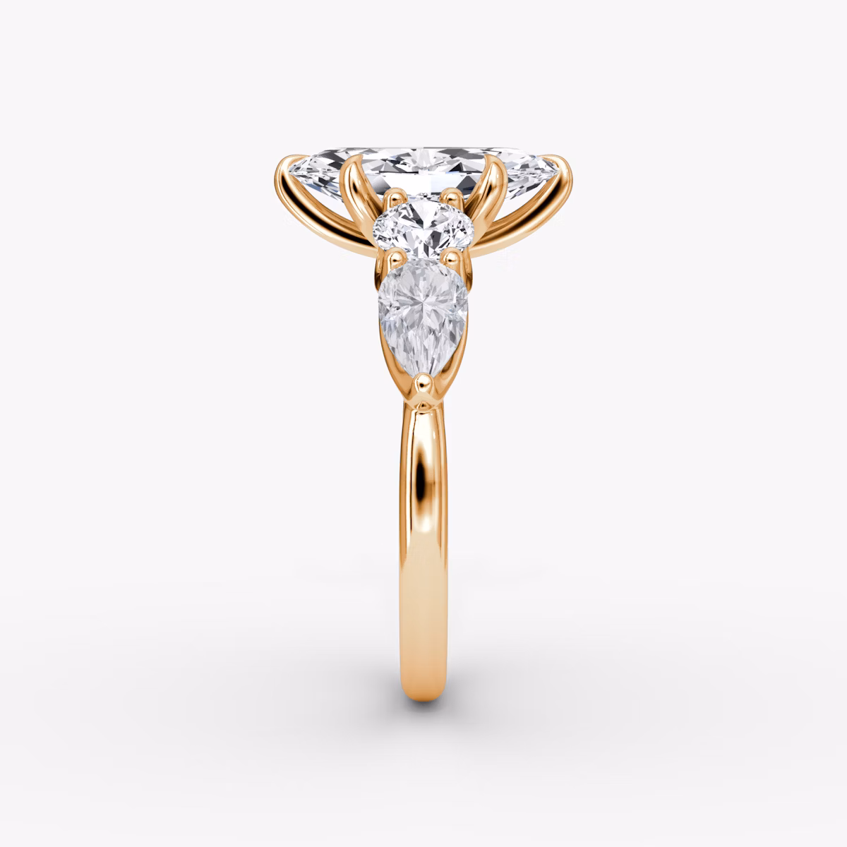 The Mixed Shape | Marquise | 14k | Rose Gold | bandAccent: Plain | sideStoneOrientation: horizontal | sideStoneShape: Round Brilliant and Pear | diamondOrientation: vertical | caratWeight: other