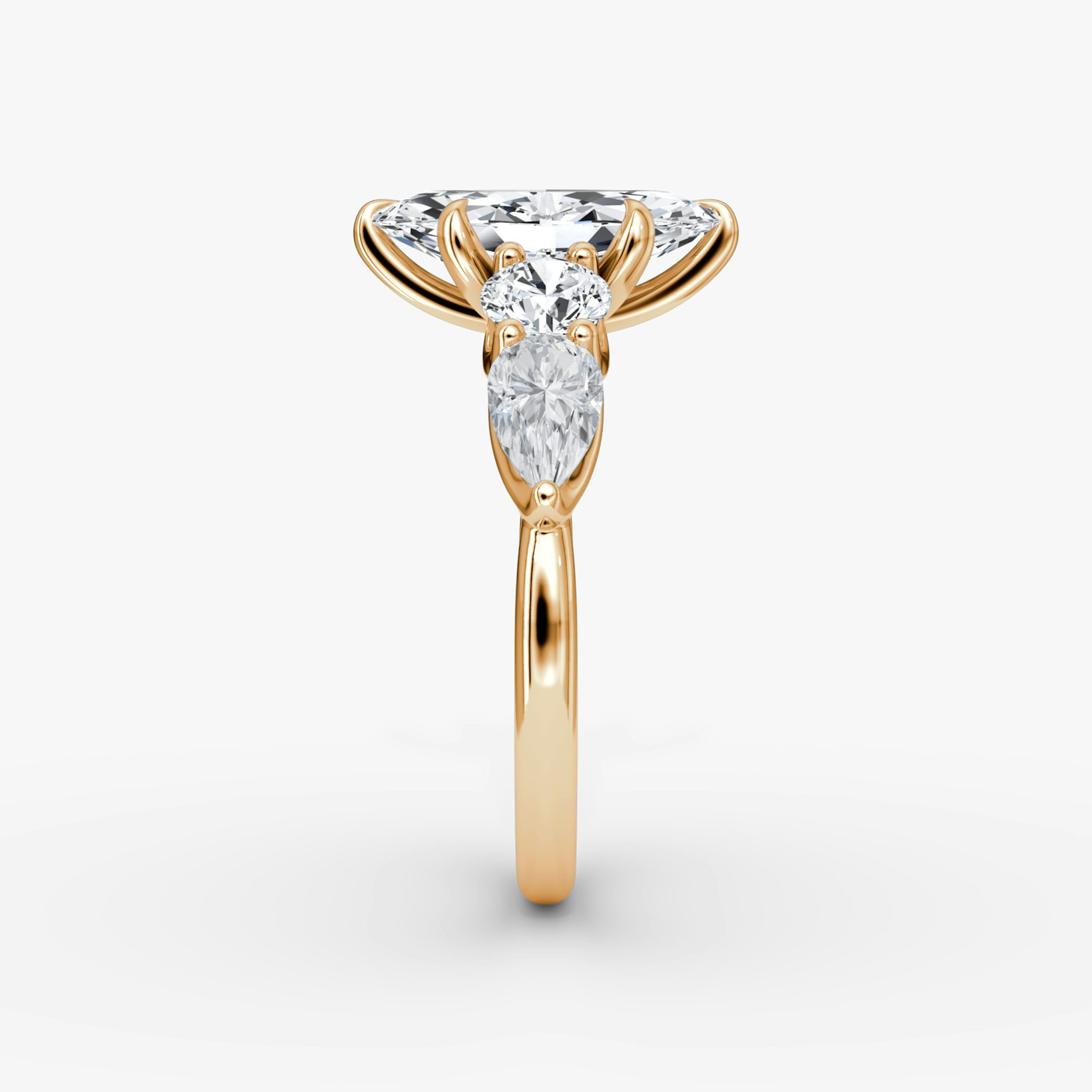 The Mixed Shape | Marquise | 14k | Rose Gold | bandAccent: Plain | sideStoneOrientation: horizontal | sideStoneShape: Round Brilliant and Pear | diamondOrientation: vertical | caratWeight: other