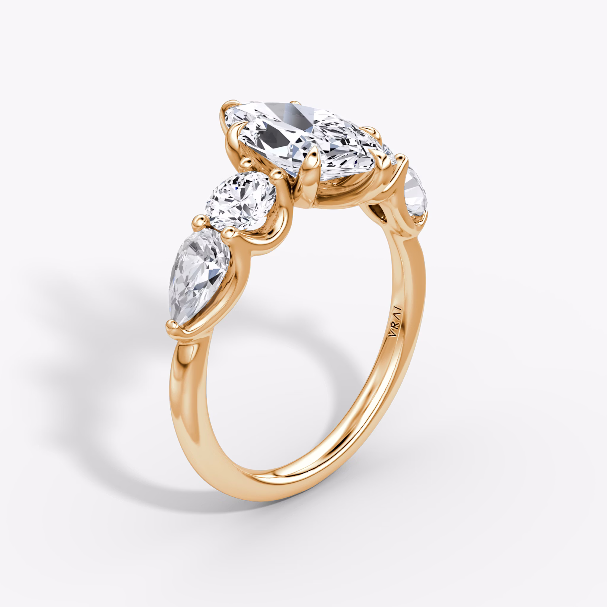 The Mixed Shape | Marquise | 14k | Rose Gold | bandAccent: Plain | sideStoneOrientation: horizontal | sideStoneShape: Round Brilliant and Pear | diamondOrientation: vertical | caratWeight: other