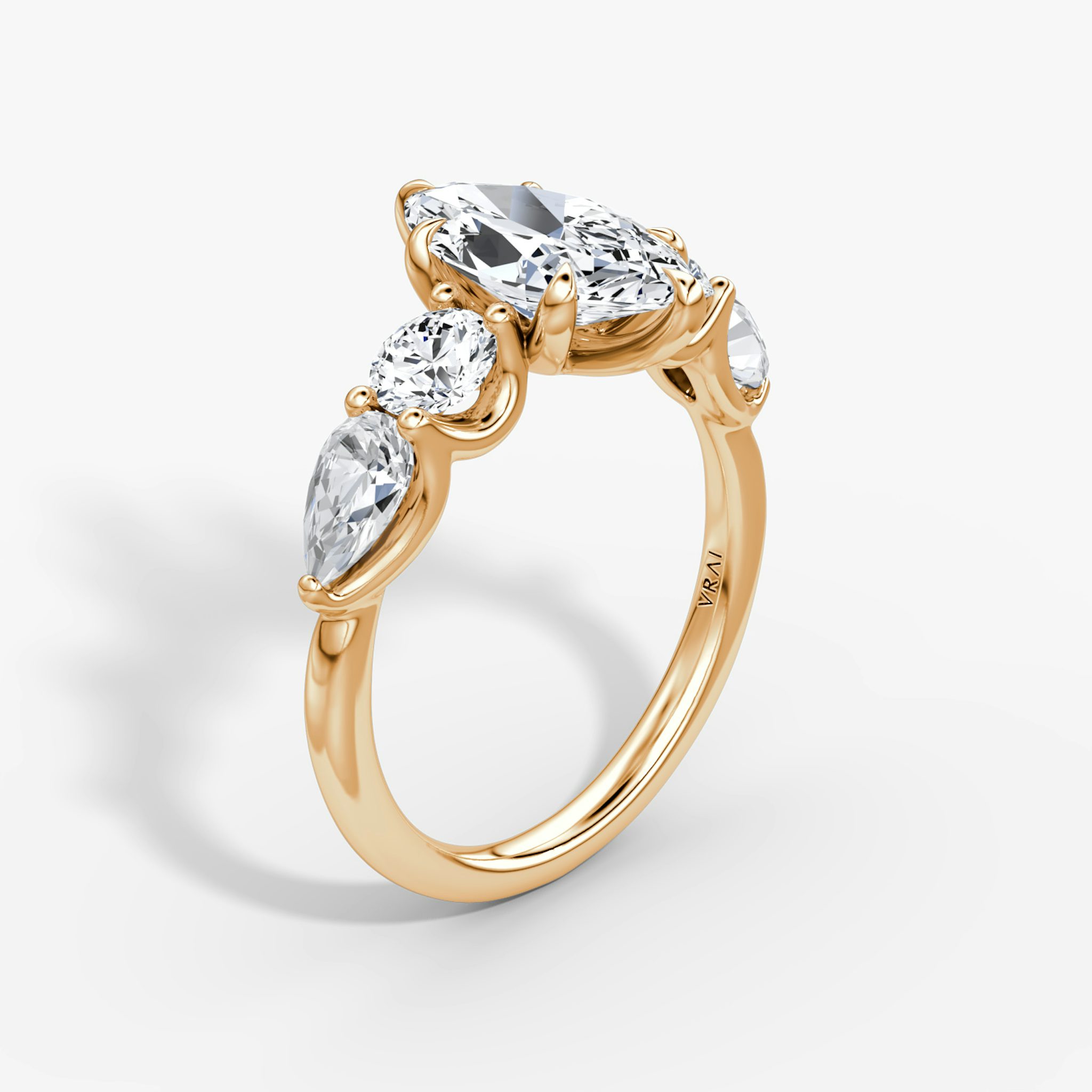 The Mixed Shape | Marquise | 14k | Rose Gold | bandAccent: Plain | sideStoneOrientation: horizontal | sideStoneShape: Round Brilliant and Pear | diamondOrientation: vertical | caratWeight: other
