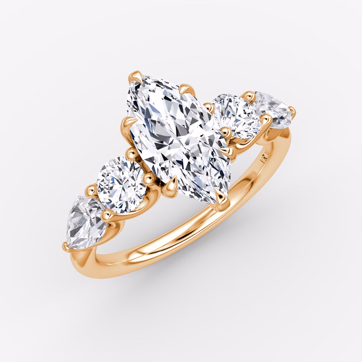 The Mixed Shape | Marquise | 14k | Rose Gold | bandAccent: Plain | sideStoneOrientation: horizontal | sideStoneShape: Round Brilliant and Pear | diamondOrientation: vertical | caratWeight: other