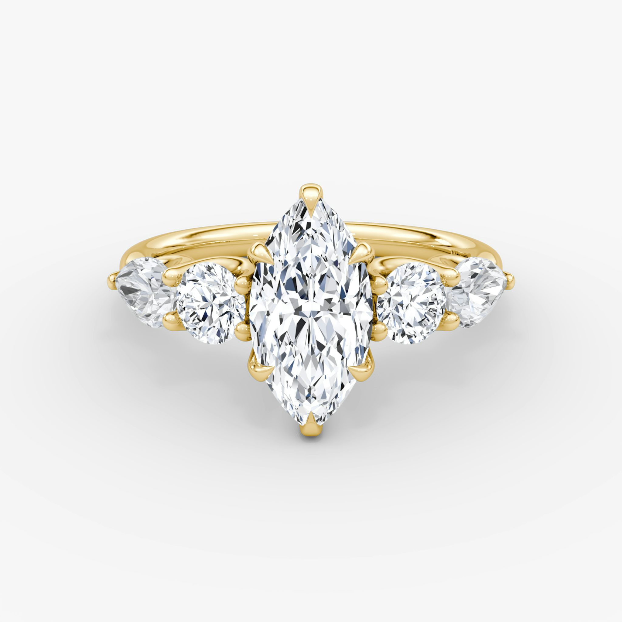 The Mixed Shape | Marquise | 18k | Yellow Gold | bandAccent: Plain | sideStoneOrientation: horizontal | sideStoneShape: Round Brilliant and Pear | diamondOrientation: vertical | caratWeight: other