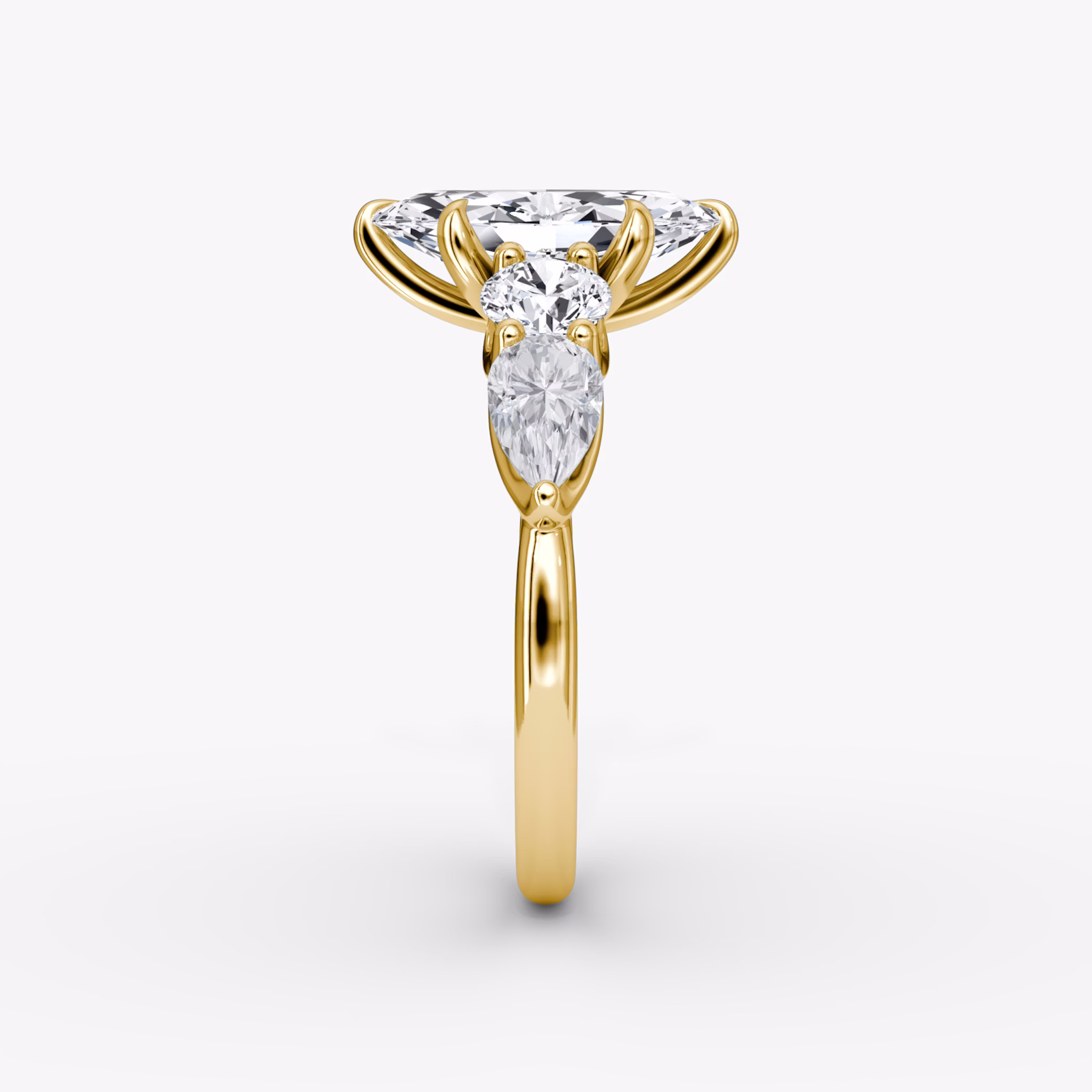 The Mixed Shape | Marquise | 18k | Yellow Gold | bandAccent: Plain | sideStoneOrientation: horizontal | sideStoneShape: Round Brilliant and Pear | diamondOrientation: vertical | caratWeight: other
