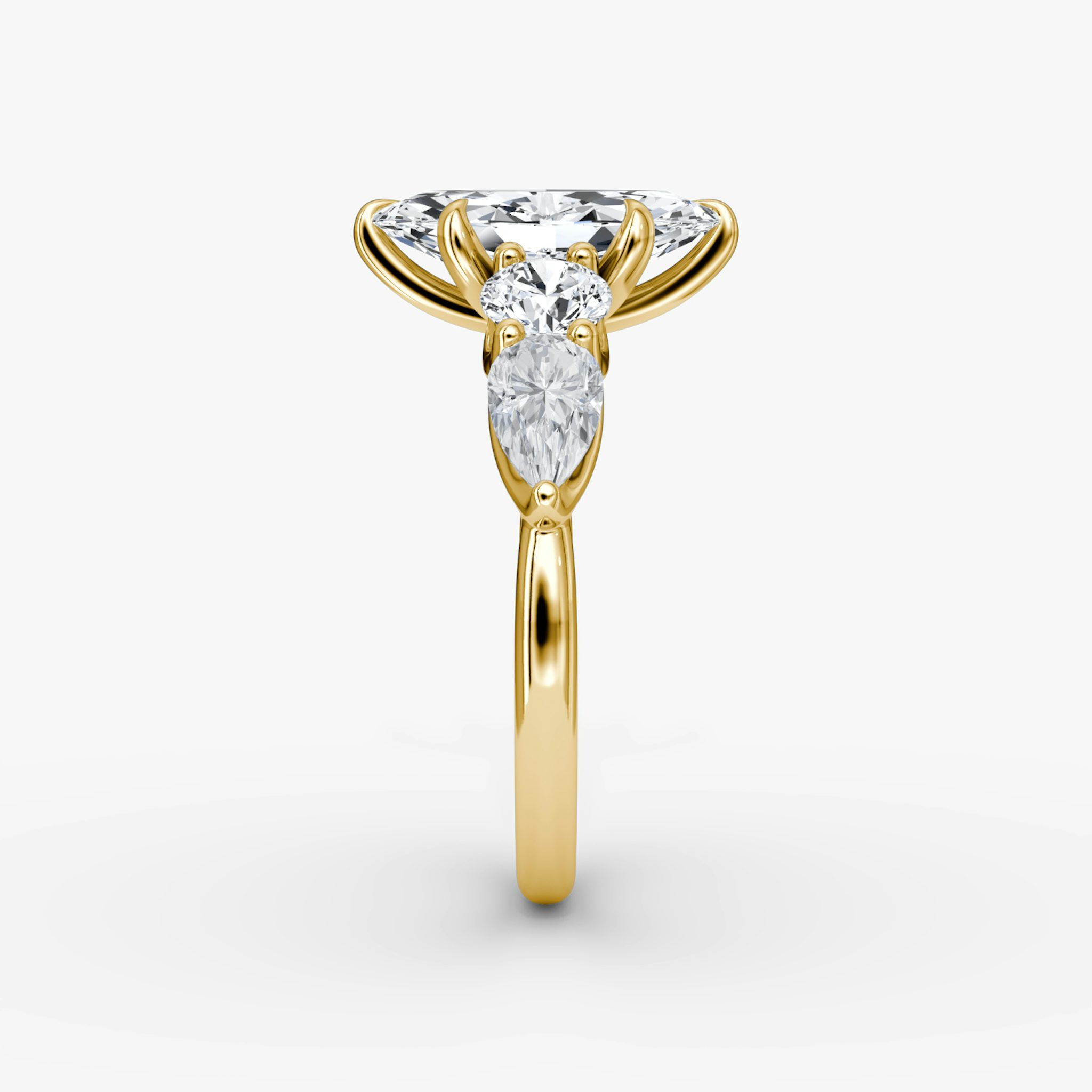 The Mixed Shape | Marquise | 18k | Yellow Gold | bandAccent: Plain | sideStoneOrientation: horizontal | sideStoneShape: Round Brilliant and Pear | diamondOrientation: vertical | caratWeight: other