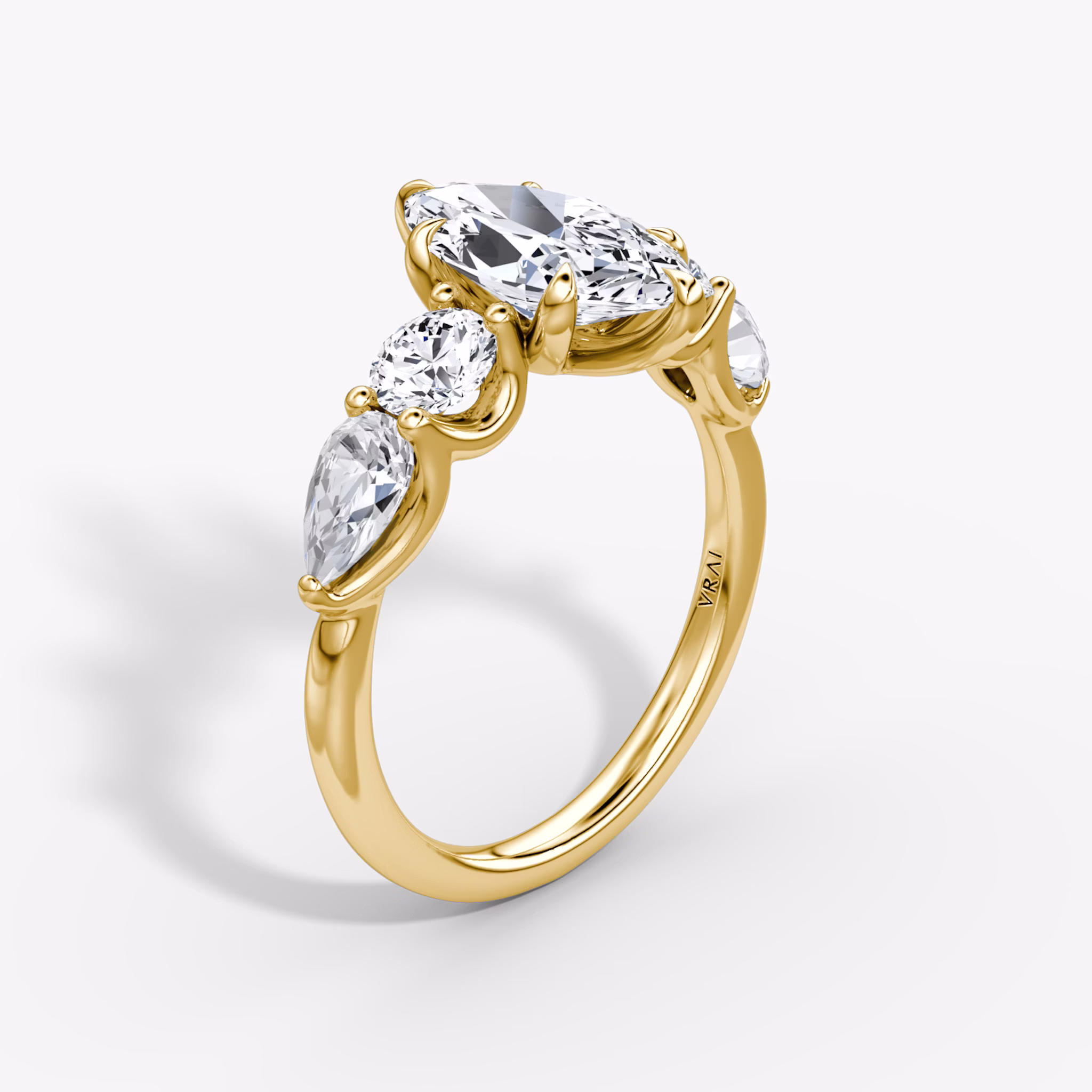 The Mixed Shape | Marquise | 18k | Yellow Gold | bandAccent: Plain | sideStoneOrientation: horizontal | sideStoneShape: Round Brilliant and Pear | diamondOrientation: vertical | caratWeight: other