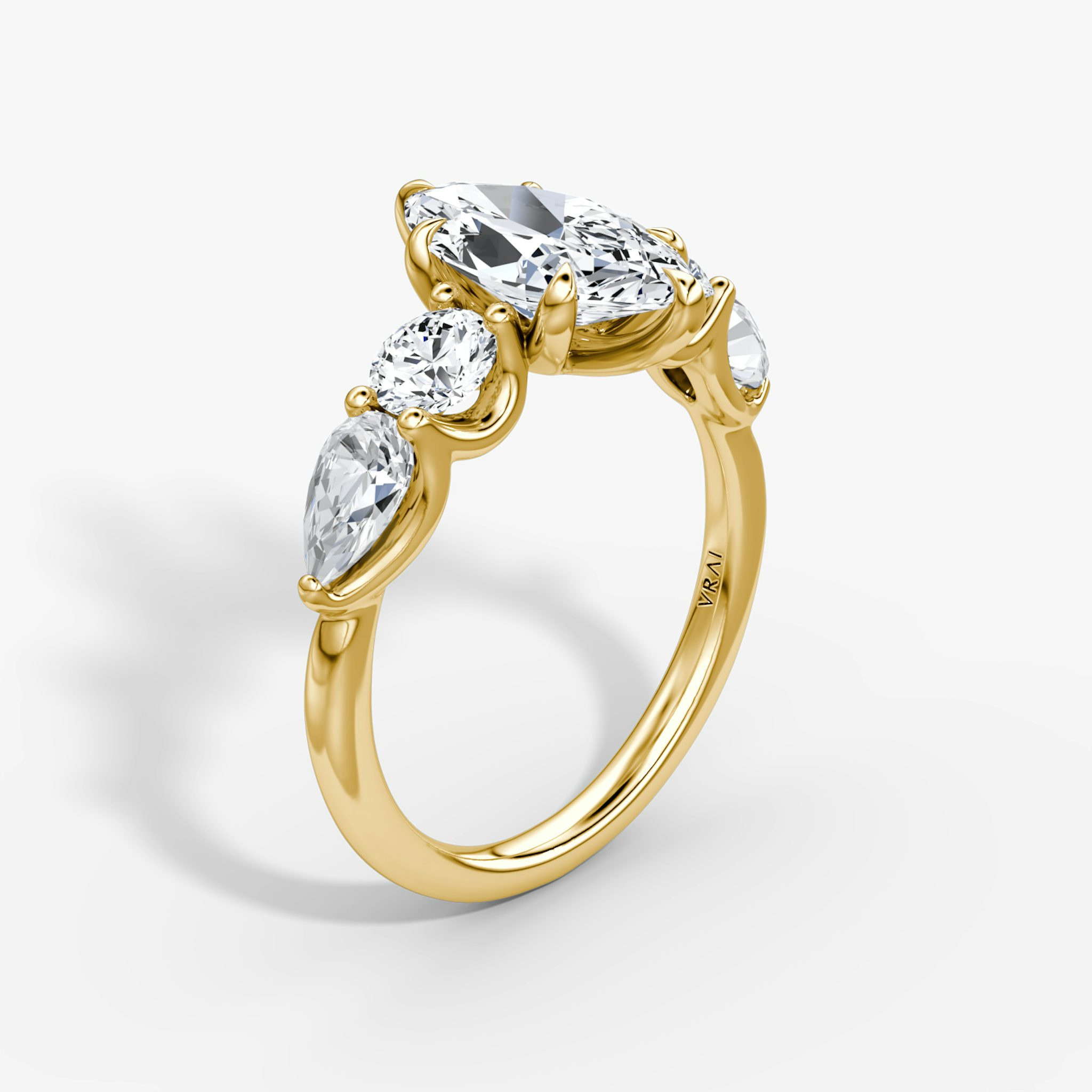 The Mixed Shape | Marquise | 18k | Yellow Gold | bandAccent: Plain | sideStoneOrientation: horizontal | sideStoneShape: Round Brilliant and Pear | diamondOrientation: vertical | caratWeight: other