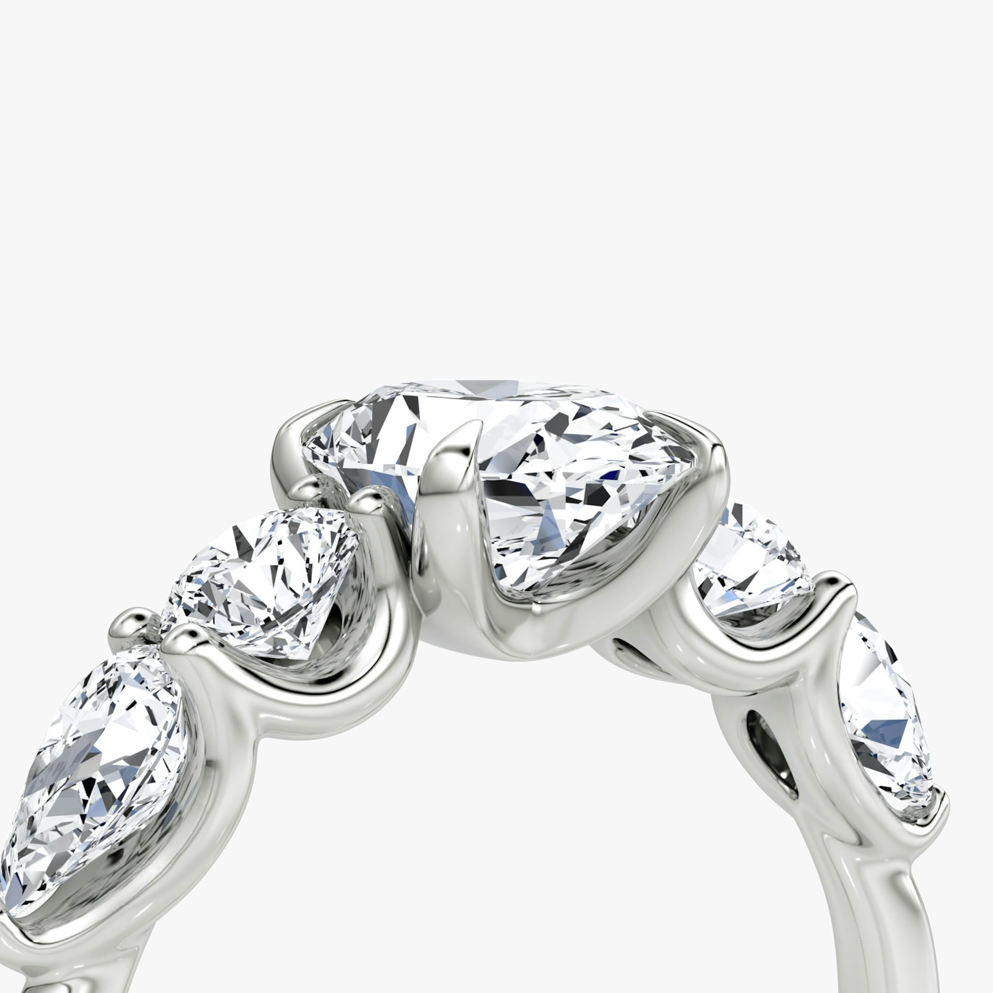 The Mixed Shape | Oval | 18k | White Gold | bandAccent: Plain | sideStoneOrientation: horizontal | sideStoneShape: Round Brilliant and Pear | diamondOrientation: vertical | caratWeight: other