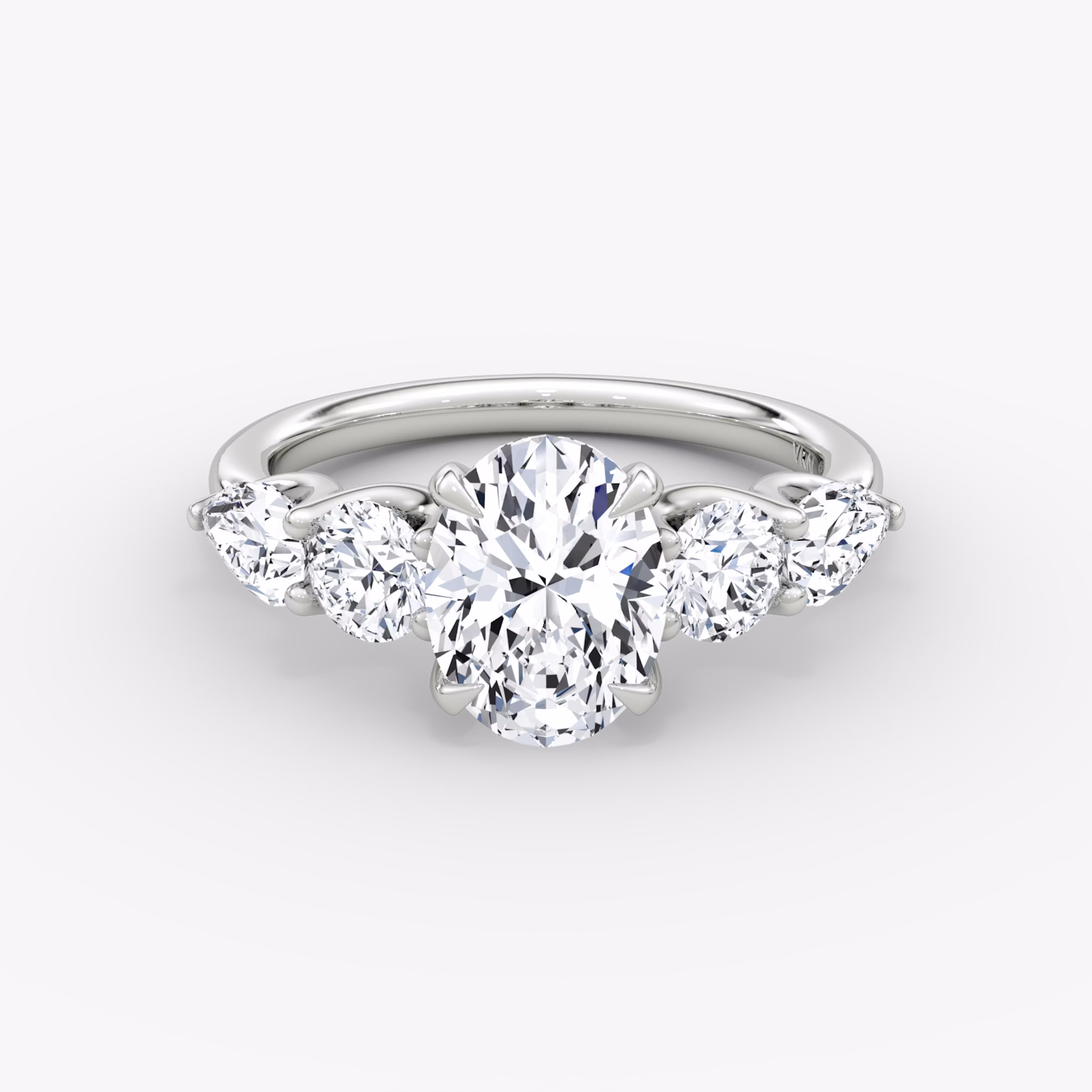 The Mixed Shape | Oval | 18k | White Gold | bandAccent: Plain | sideStoneOrientation: horizontal | sideStoneShape: Round Brilliant and Pear | diamondOrientation: vertical | caratWeight: other