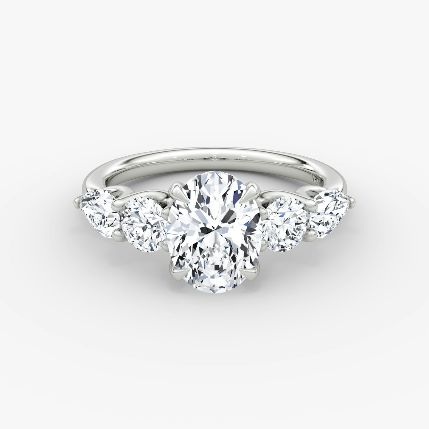 The Mixed Shape | Oval | Platinum | bandAccent: Plain | sideStoneOrientation: horizontal | sideStoneShape: Round Brilliant and Pear | diamondOrientation: vertical | caratWeight: other