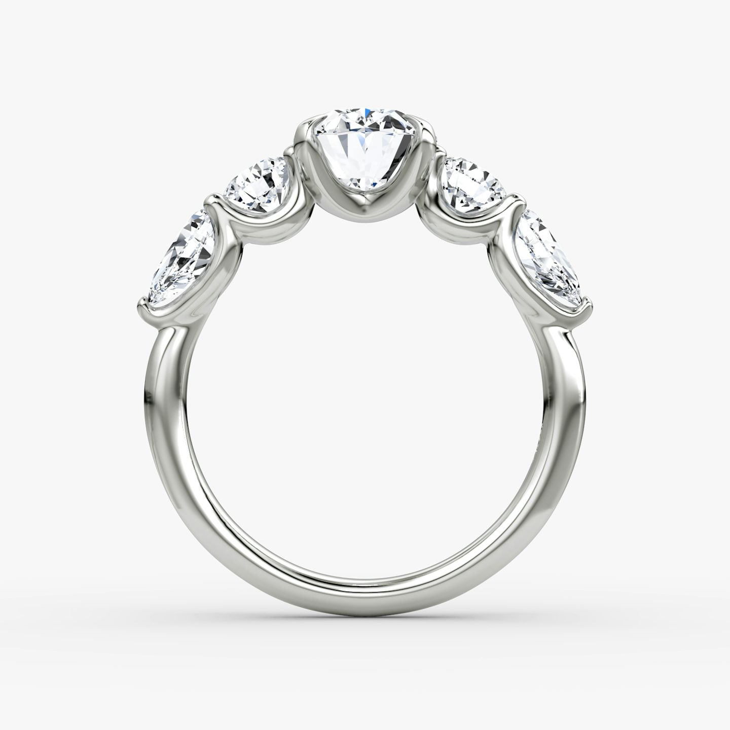 The Mixed Shape | Oval | Platinum | bandAccent: Plain | sideStoneOrientation: horizontal | sideStoneShape: Round Brilliant and Pear | diamondOrientation: vertical | caratWeight: other