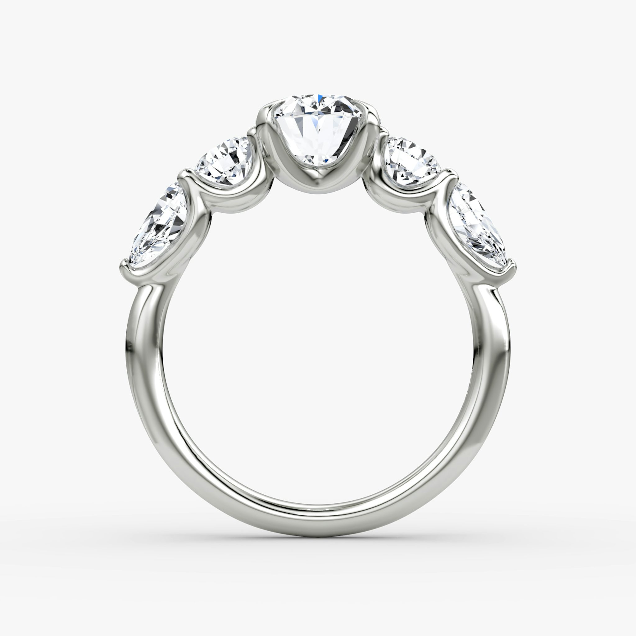 The Mixed Shape | Oval | 18k | White Gold | bandAccent: Plain | sideStoneOrientation: horizontal | sideStoneShape: Round Brilliant and Pear | diamondOrientation: vertical | caratWeight: other