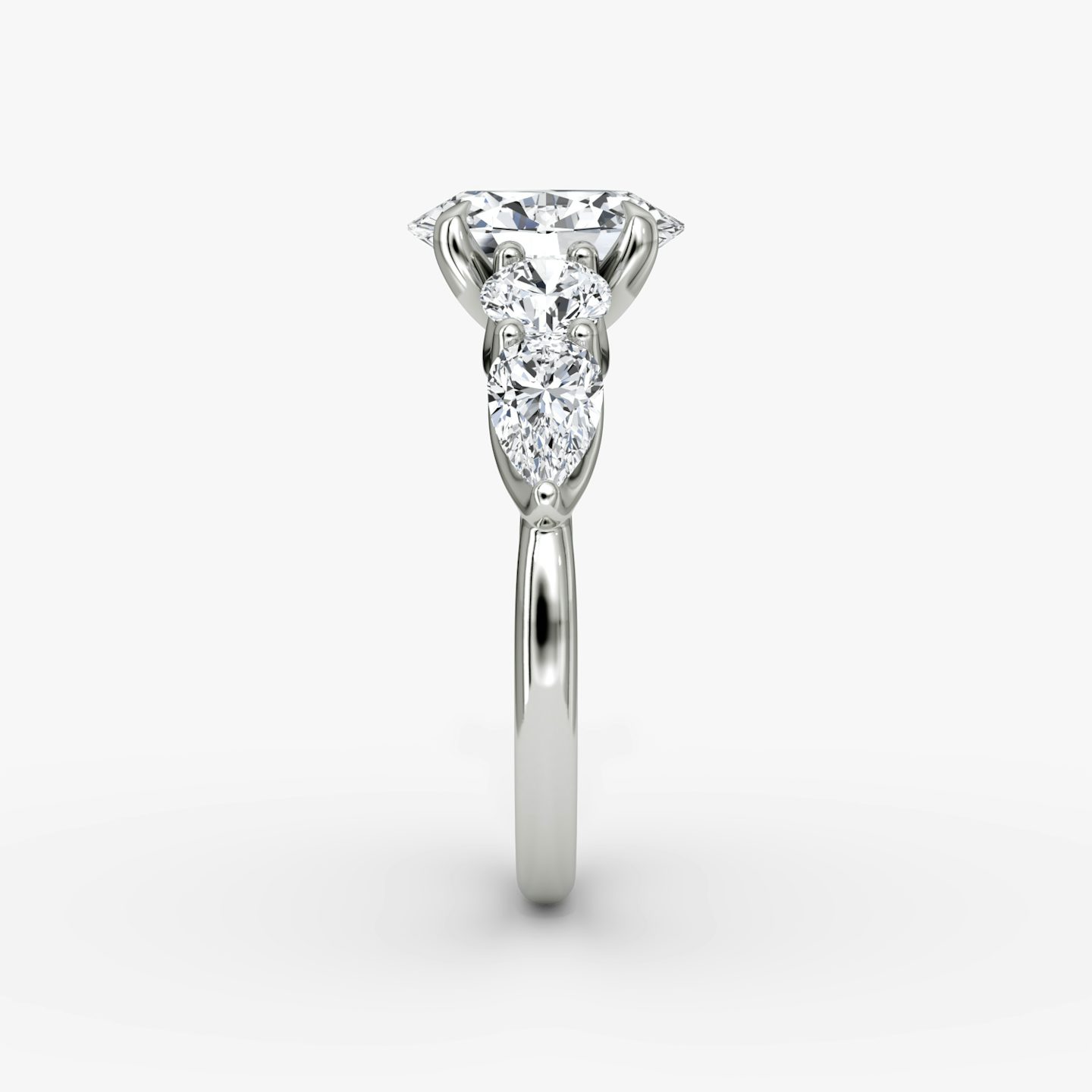 The Mixed Shape | Oval | Platinum | bandAccent: Plain | sideStoneOrientation: horizontal | sideStoneShape: Round Brilliant and Pear | diamondOrientation: vertical | caratWeight: other