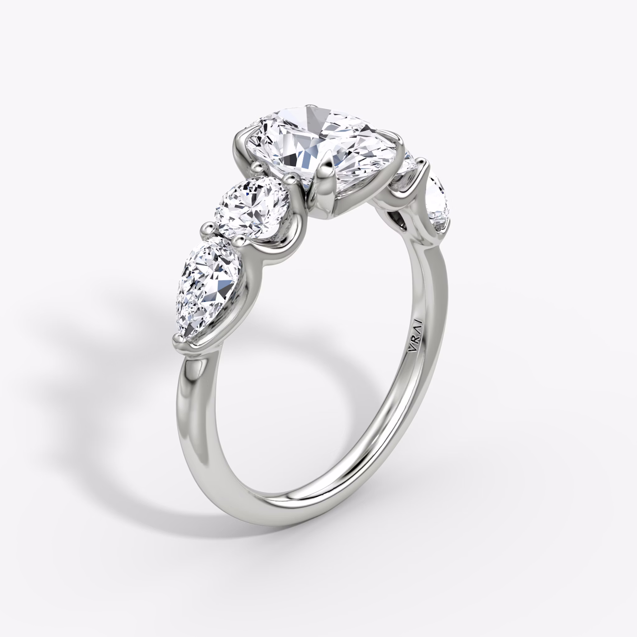 The Mixed Shape | Oval | 18k | White Gold | bandAccent: Plain | sideStoneOrientation: horizontal | sideStoneShape: Round Brilliant and Pear | diamondOrientation: vertical | caratWeight: other