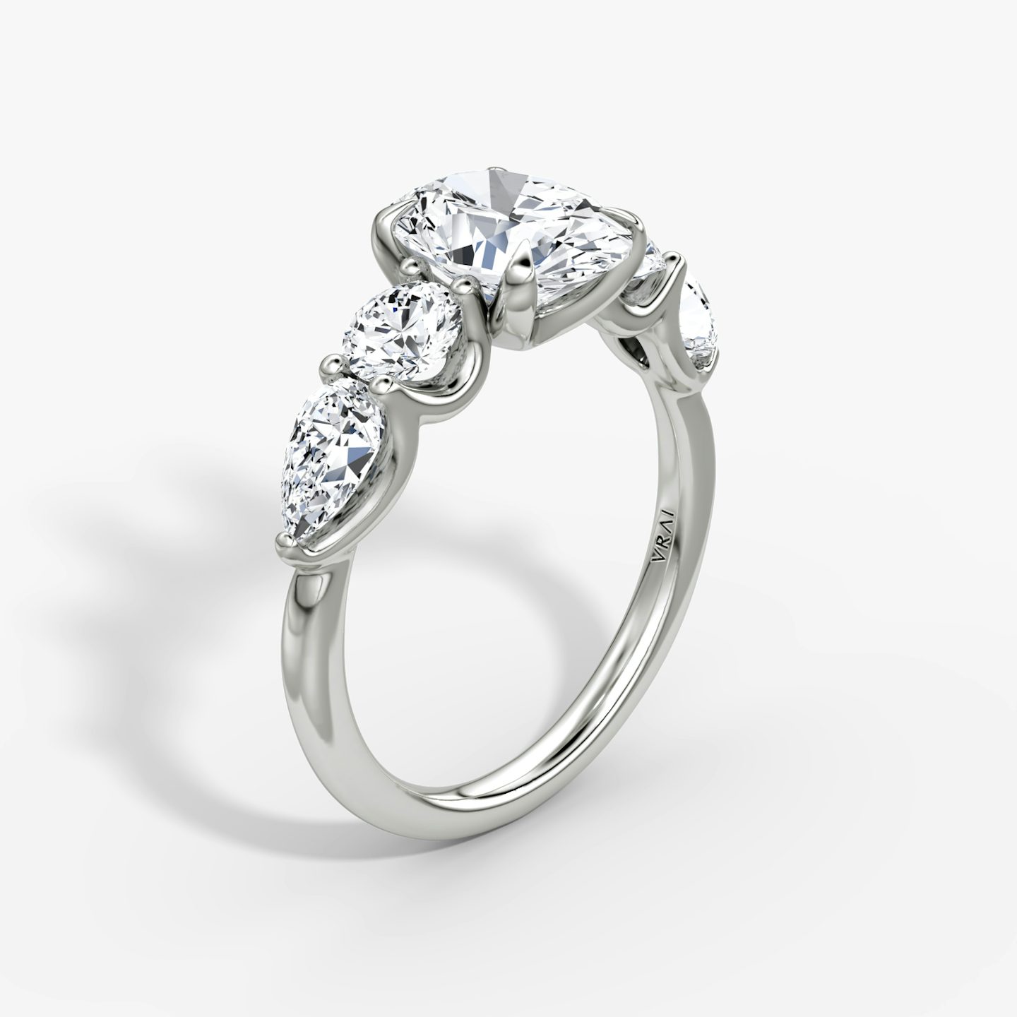 The Mixed Shape | Oval | Platinum | bandAccent: Plain | sideStoneOrientation: horizontal | sideStoneShape: Round Brilliant and Pear | diamondOrientation: vertical | caratWeight: other