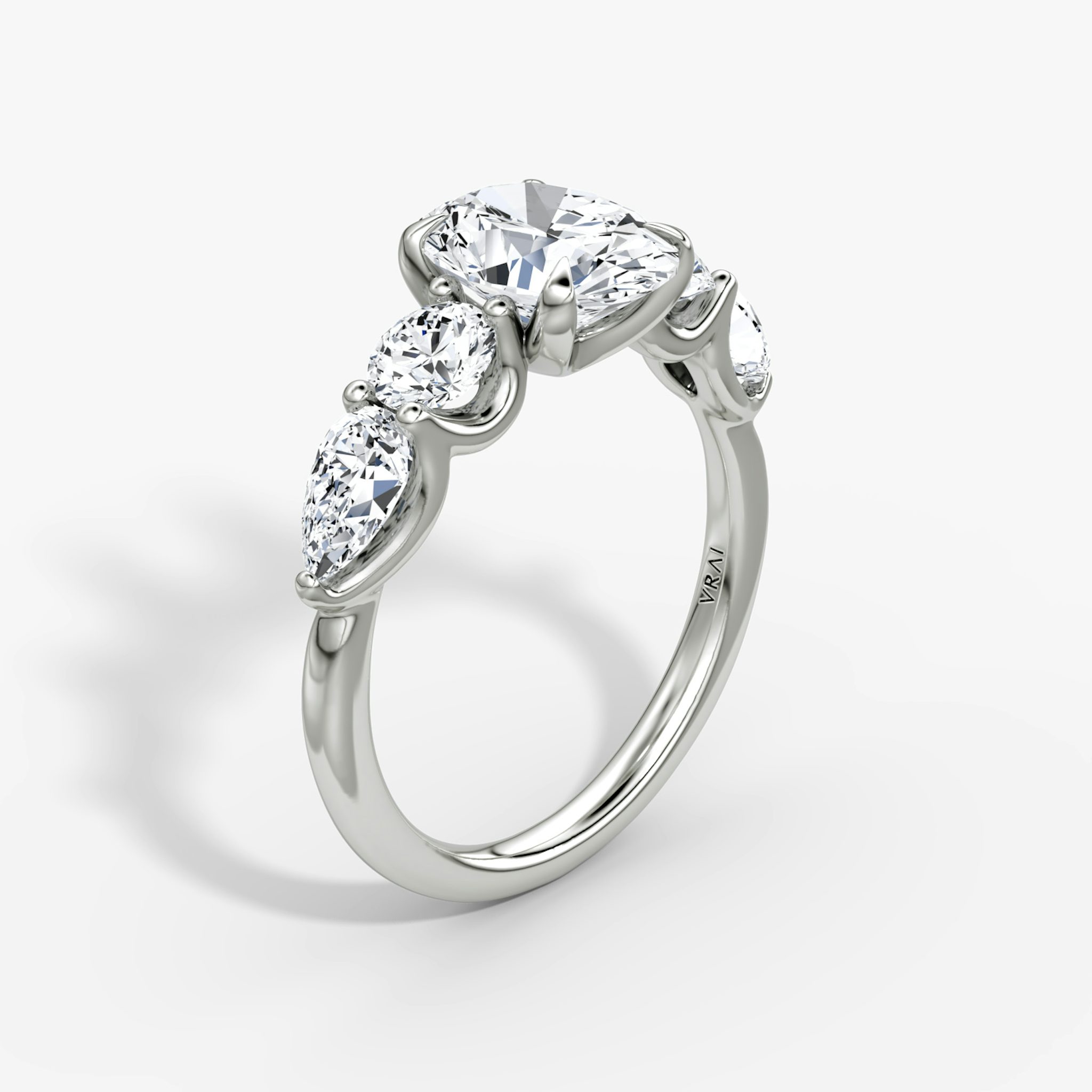 The Mixed Shape | Oval | 18k | White Gold | bandAccent: Plain | sideStoneOrientation: horizontal | sideStoneShape: Round Brilliant and Pear | diamondOrientation: vertical | caratWeight: other