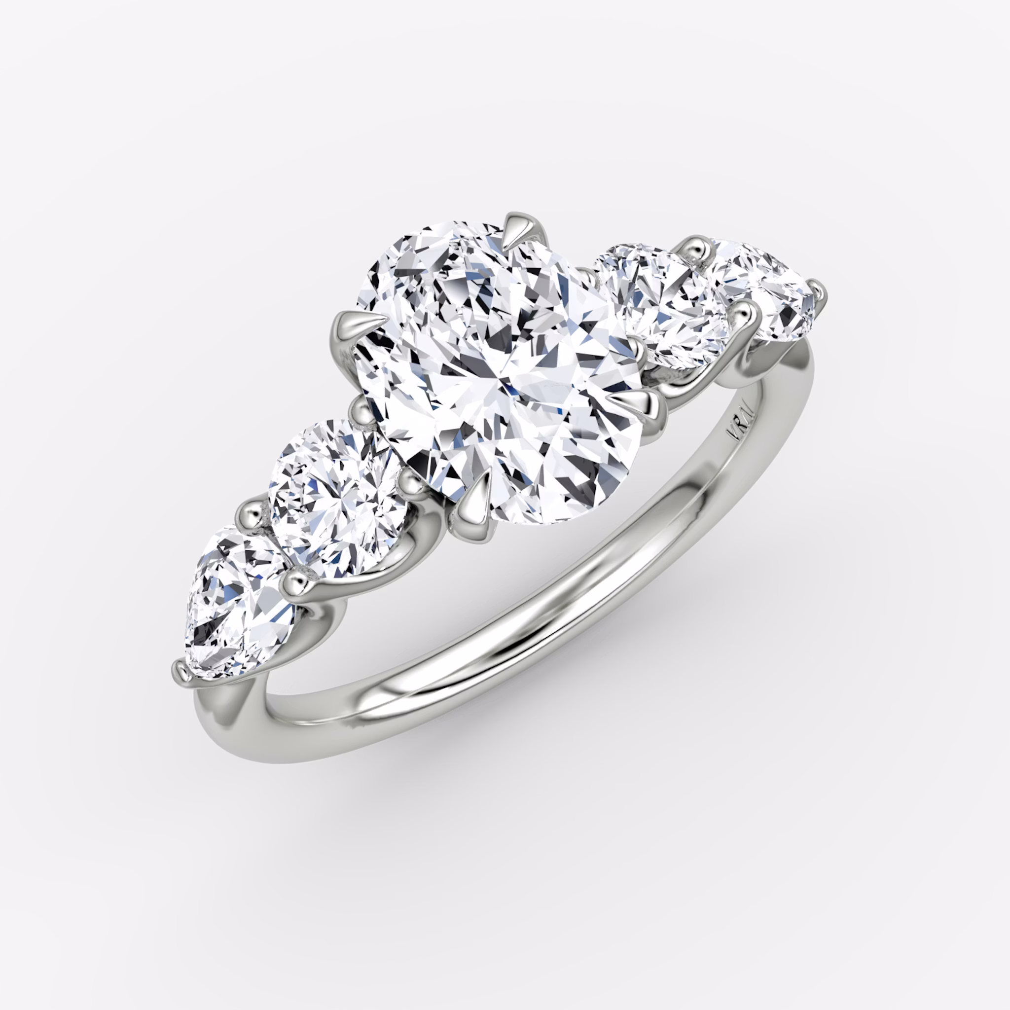 The Mixed Shape | Oval | 18k | White Gold | bandAccent: Plain | sideStoneOrientation: horizontal | sideStoneShape: Round Brilliant and Pear | diamondOrientation: vertical | caratWeight: other
