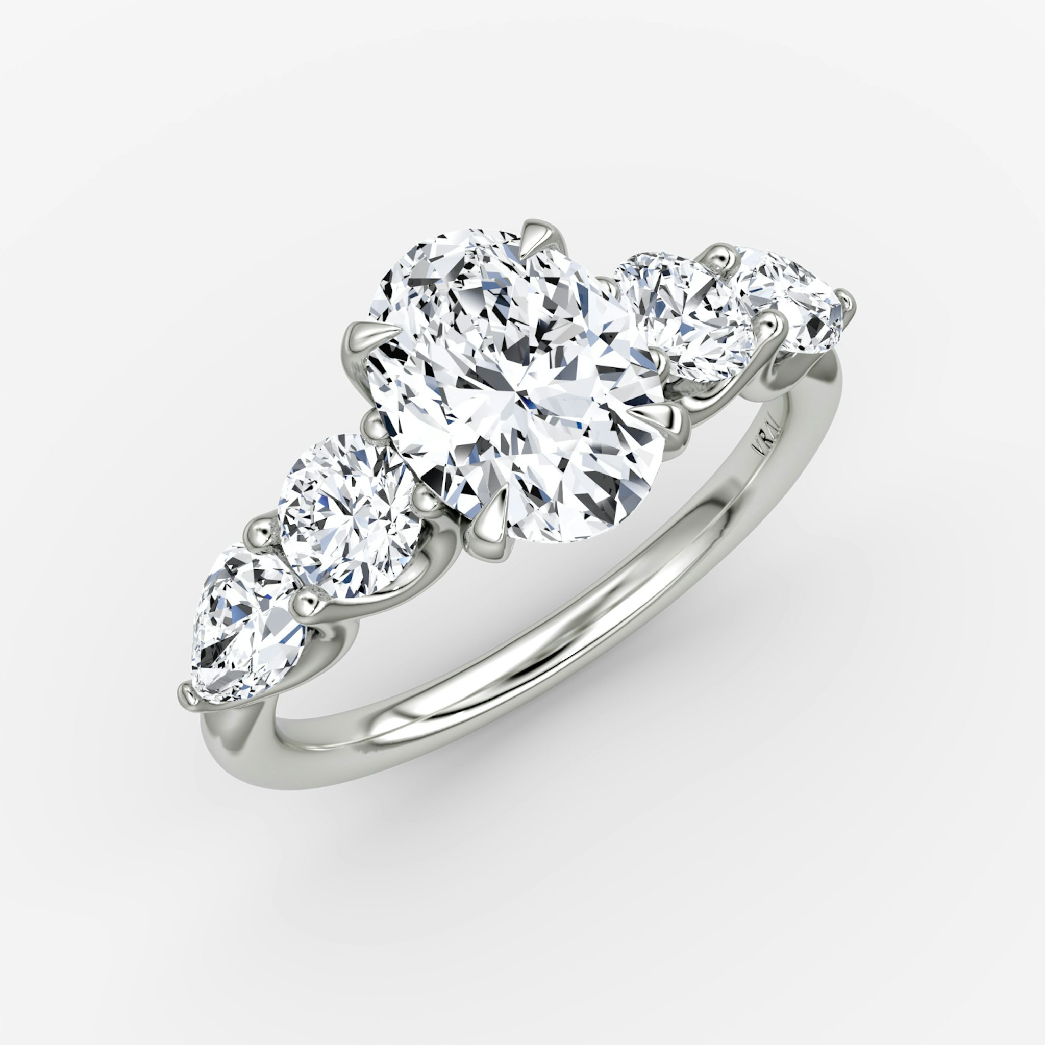 The Mixed Shape | Oval | 18k | White Gold | bandAccent: Plain | sideStoneOrientation: horizontal | sideStoneShape: Round Brilliant and Pear | diamondOrientation: vertical | caratWeight: other