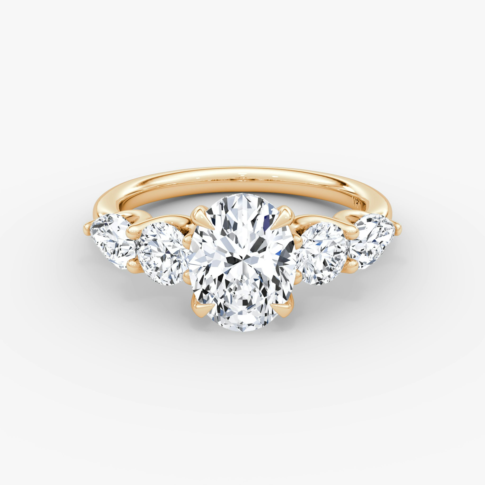 The Mixed Shape | Oval | 14k | Rose Gold | bandAccent: Plain | sideStoneOrientation: horizontal | sideStoneShape: Round Brilliant and Pear | diamondOrientation: vertical | caratWeight: other