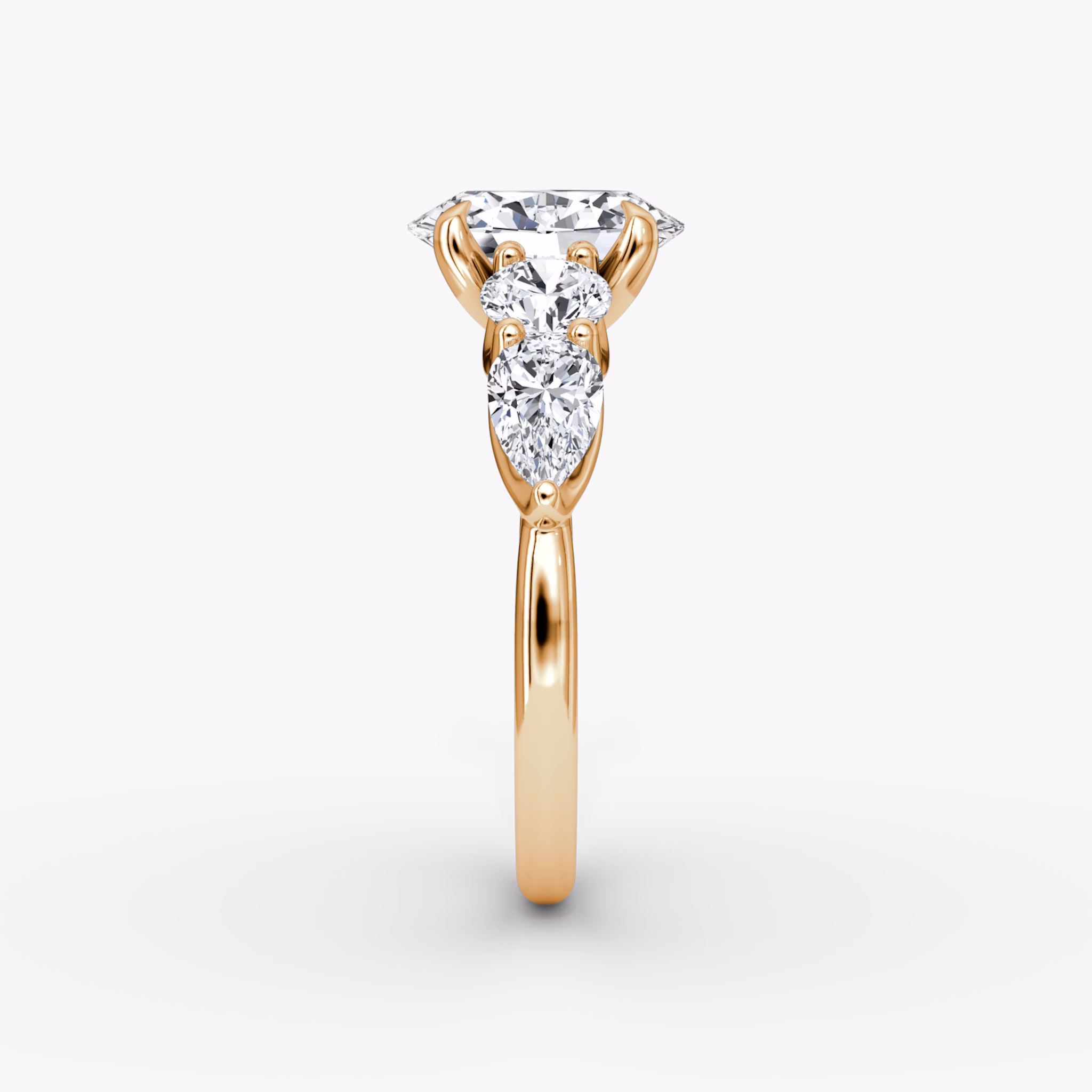 The Mixed Shape | Oval | 14k | Rose Gold | bandAccent: Plain | sideStoneOrientation: horizontal | sideStoneShape: Round Brilliant and Pear | diamondOrientation: vertical | caratWeight: other