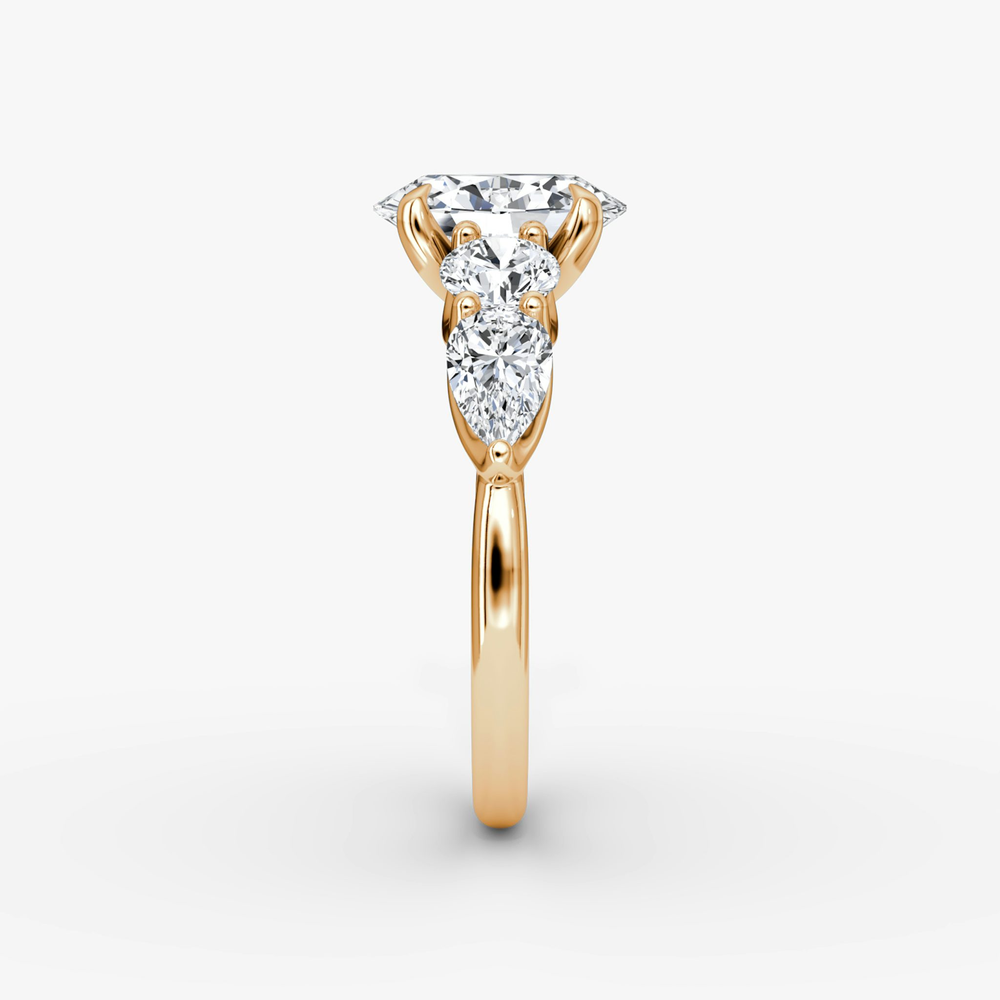 The Mixed Shape | Oval | 14k | Rose Gold | bandAccent: Plain | sideStoneOrientation: horizontal | sideStoneShape: Round Brilliant and Pear | diamondOrientation: vertical | caratWeight: other