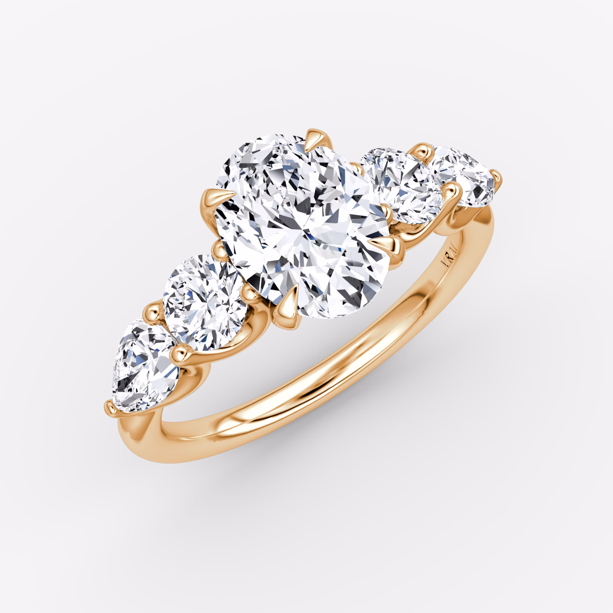 The Mixed Shape | Oval | 14k | Rose Gold | bandAccent: Plain | sideStoneOrientation: horizontal | sideStoneShape: Round Brilliant and Pear | diamondOrientation: vertical | caratWeight: other