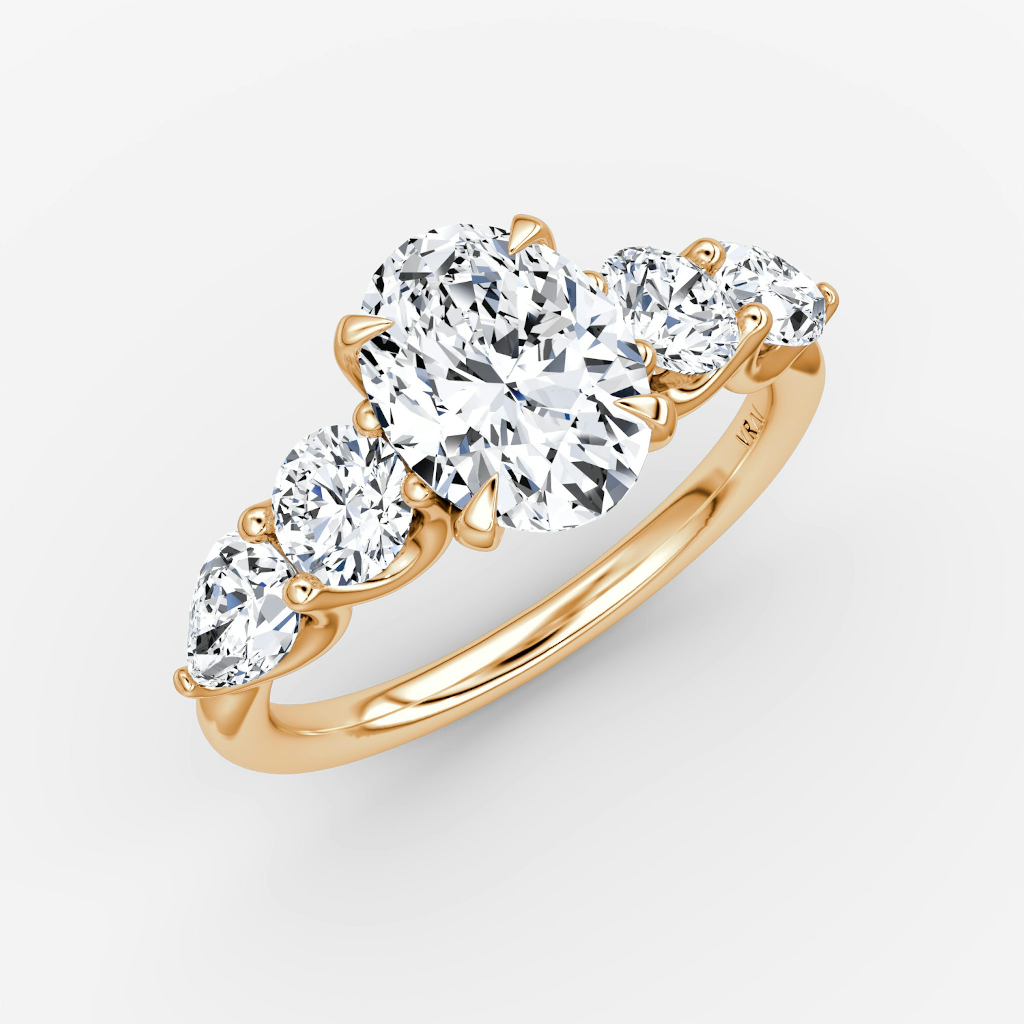 The Mixed Shape | Oval | 14k | Rose Gold | bandAccent: Plain | sideStoneOrientation: horizontal | sideStoneShape: Round Brilliant and Pear | diamondOrientation: vertical | caratWeight: other