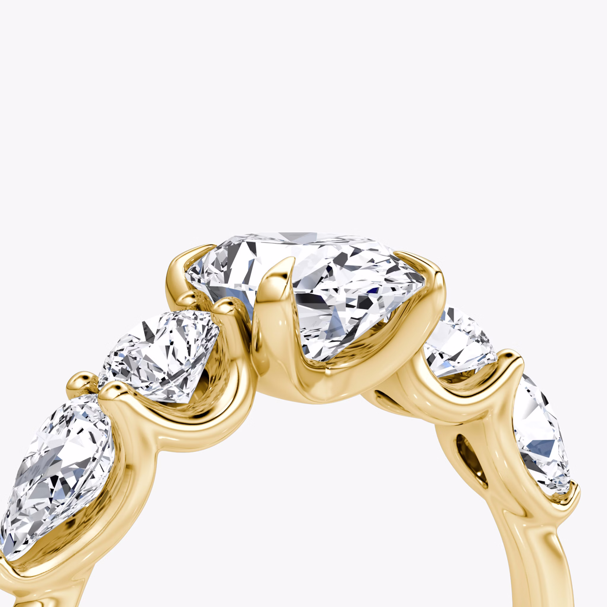 The Mixed Shape | Oval | 18k | Yellow Gold | bandAccent: Plain | sideStoneOrientation: horizontal | sideStoneShape: Round Brilliant and Pear | diamondOrientation: vertical | caratWeight: other