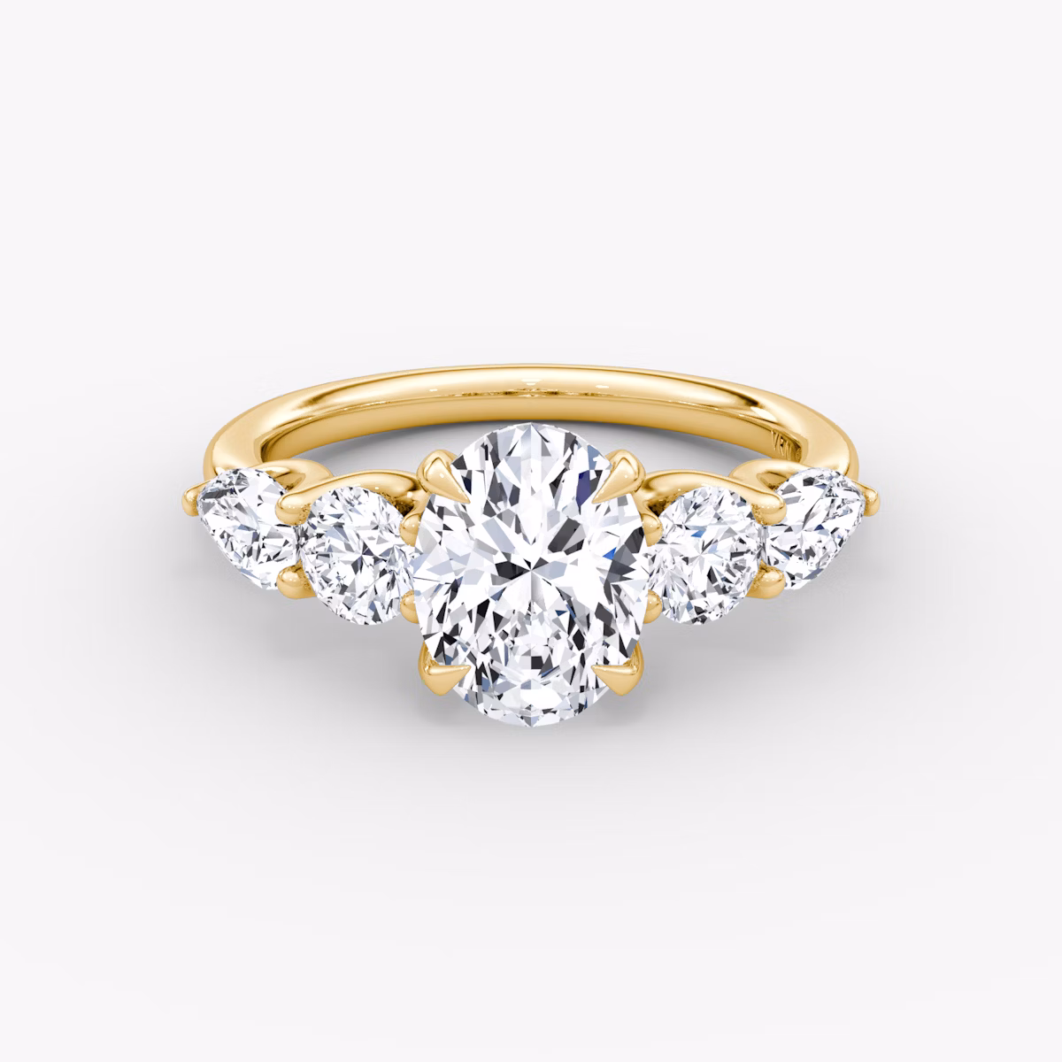 The Mixed Shape | Oval | 18k | Yellow Gold | bandAccent: Plain | sideStoneOrientation: horizontal | sideStoneShape: Round Brilliant and Pear | diamondOrientation: vertical | caratWeight: other