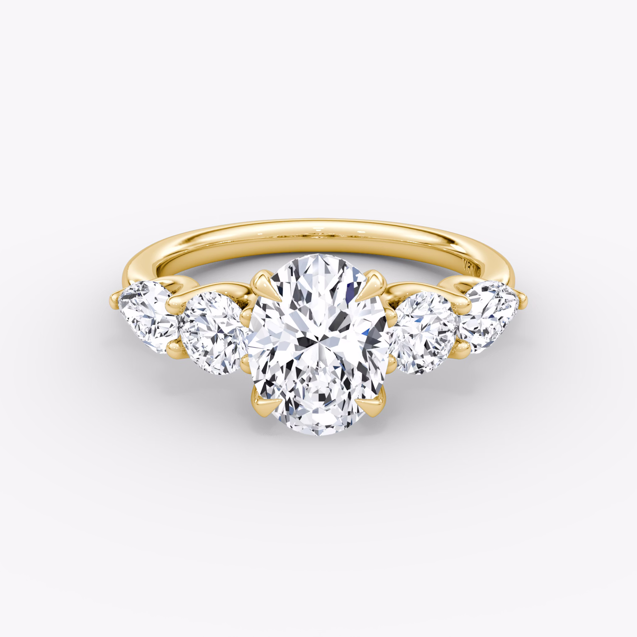 The Mixed Shape | Oval | 18k | Yellow Gold | bandAccent: Plain | sideStoneOrientation: horizontal | sideStoneShape: Round Brilliant and Pear | diamondOrientation: vertical | caratWeight: other