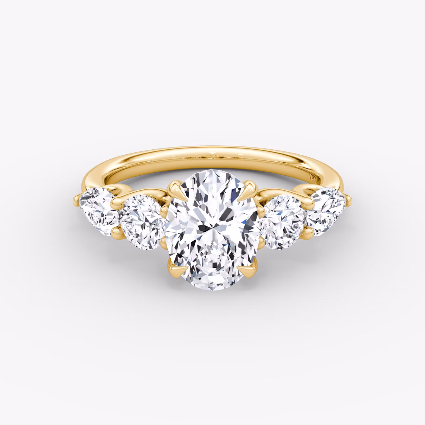 The Mixed Shape | Oval | 18k | Yellow Gold | bandAccent: Plain | sideStoneOrientation: horizontal | sideStoneShape: Round Brilliant and Pear | diamondOrientation: vertical | caratWeight: other