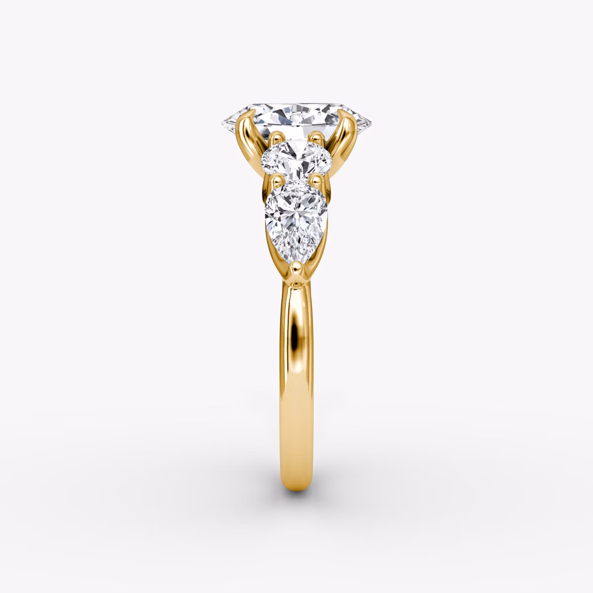 The Mixed Shape | Oval | 18k | Yellow Gold | bandAccent: Plain | sideStoneOrientation: horizontal | sideStoneShape: Round Brilliant and Pear | diamondOrientation: vertical | caratWeight: other