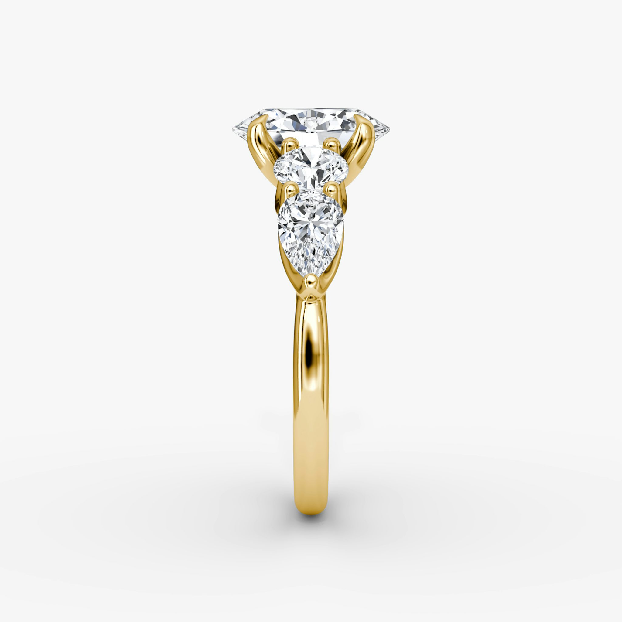 The Mixed Shape | Oval | 18k | Yellow Gold | bandAccent: Plain | sideStoneOrientation: horizontal | sideStoneShape: Round Brilliant and Pear | diamondOrientation: vertical | caratWeight: other