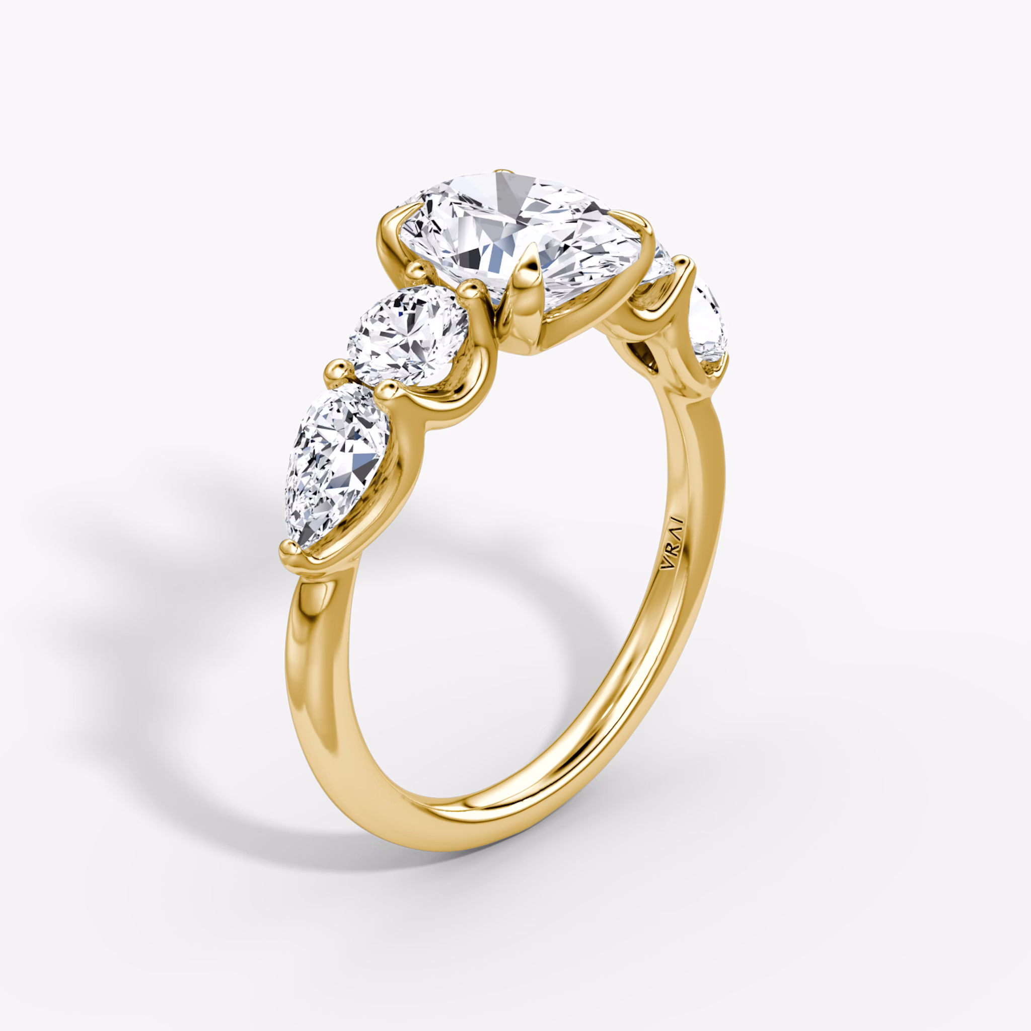 The Mixed Shape | Oval | 18k | Yellow Gold | bandAccent: Plain | sideStoneOrientation: horizontal | sideStoneShape: Round Brilliant and Pear | diamondOrientation: vertical | caratWeight: other