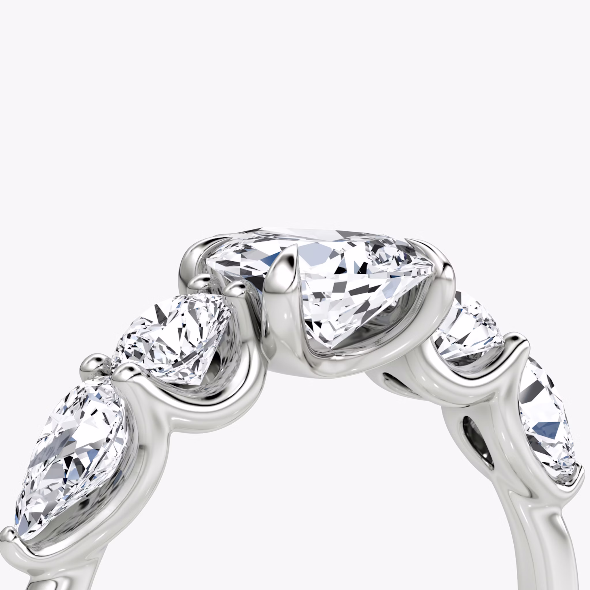 The Mixed Shape | Pear | 18k | White Gold | bandAccent: Plain | sideStoneOrientation: horizontal | sideStoneShape: Round Brilliant and Pear | diamondOrientation: vertical | caratWeight: other