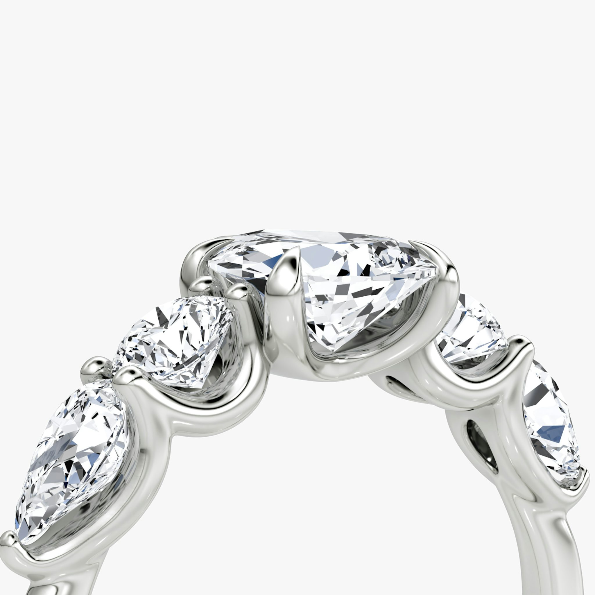 The Mixed Shape | Pear | 18k | White Gold | bandAccent: Plain | sideStoneOrientation: horizontal | sideStoneShape: Round Brilliant and Pear | diamondOrientation: vertical | caratWeight: other