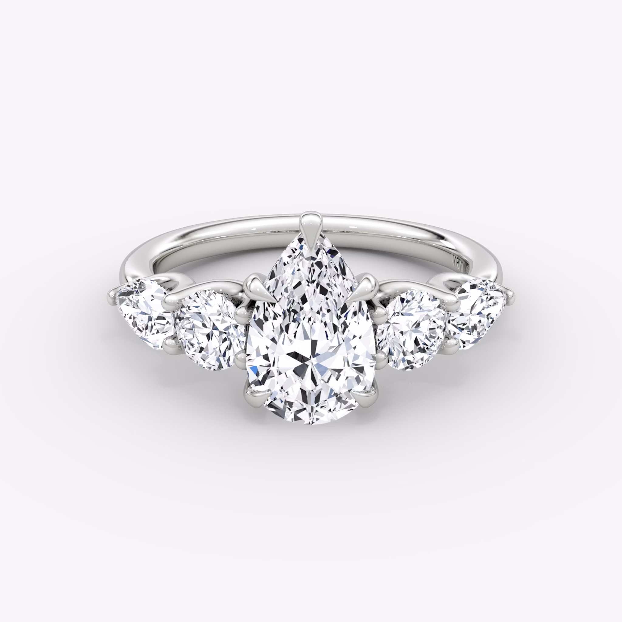 The Mixed Shape | Pear | 18k | White Gold | bandAccent: Plain | sideStoneOrientation: horizontal | sideStoneShape: Round Brilliant and Pear | diamondOrientation: vertical | caratWeight: other