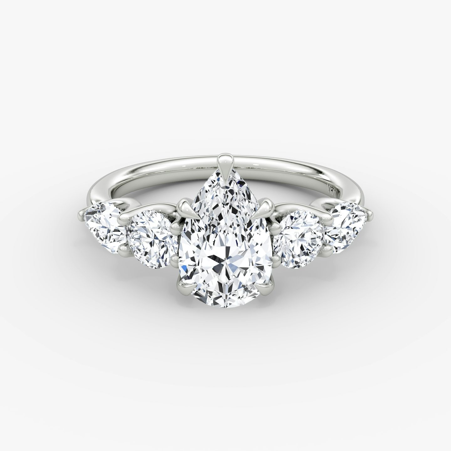 The Mixed Shape | Pear | 18k | White Gold | bandAccent: Plain | sideStoneOrientation: horizontal | sideStoneShape: Round Brilliant and Pear | diamondOrientation: vertical | caratWeight: other