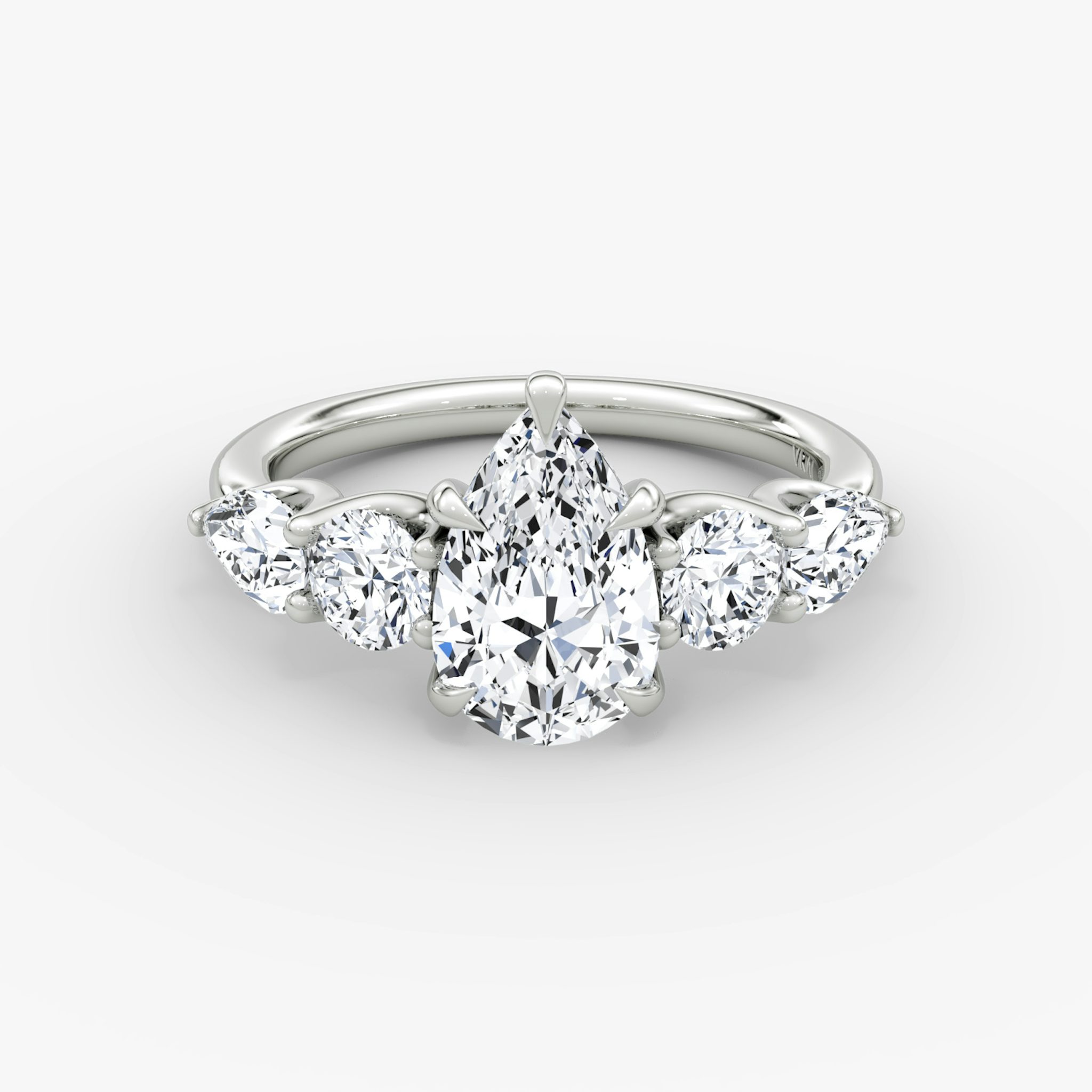 The Mixed Shape | Pear | 18k | White Gold | bandAccent: Plain | sideStoneOrientation: horizontal | sideStoneShape: Round Brilliant and Pear | diamondOrientation: vertical | caratWeight: other