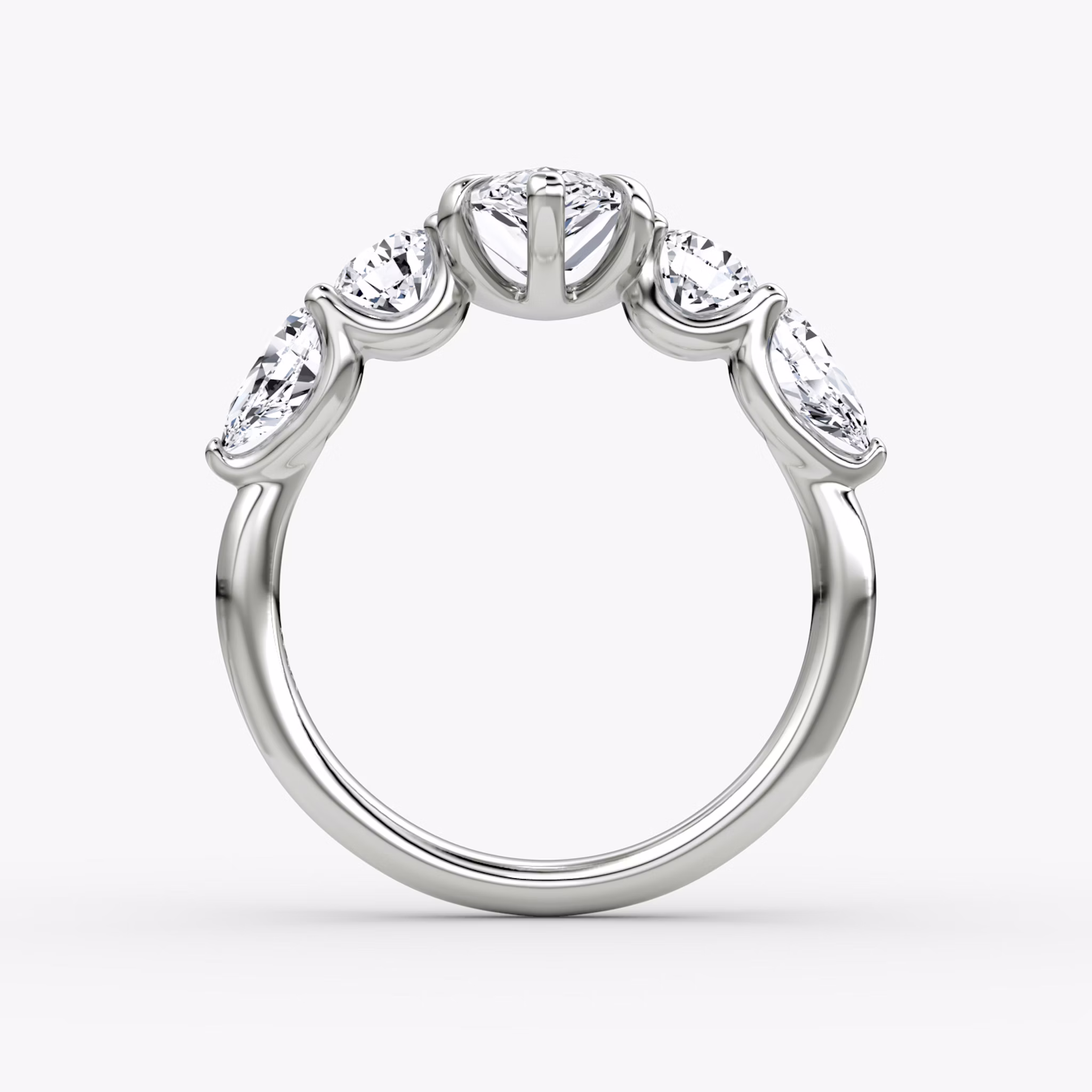 The Mixed Shape | Pear | 18k | White Gold | bandAccent: Plain | sideStoneOrientation: horizontal | sideStoneShape: Round Brilliant and Pear | diamondOrientation: vertical | caratWeight: other