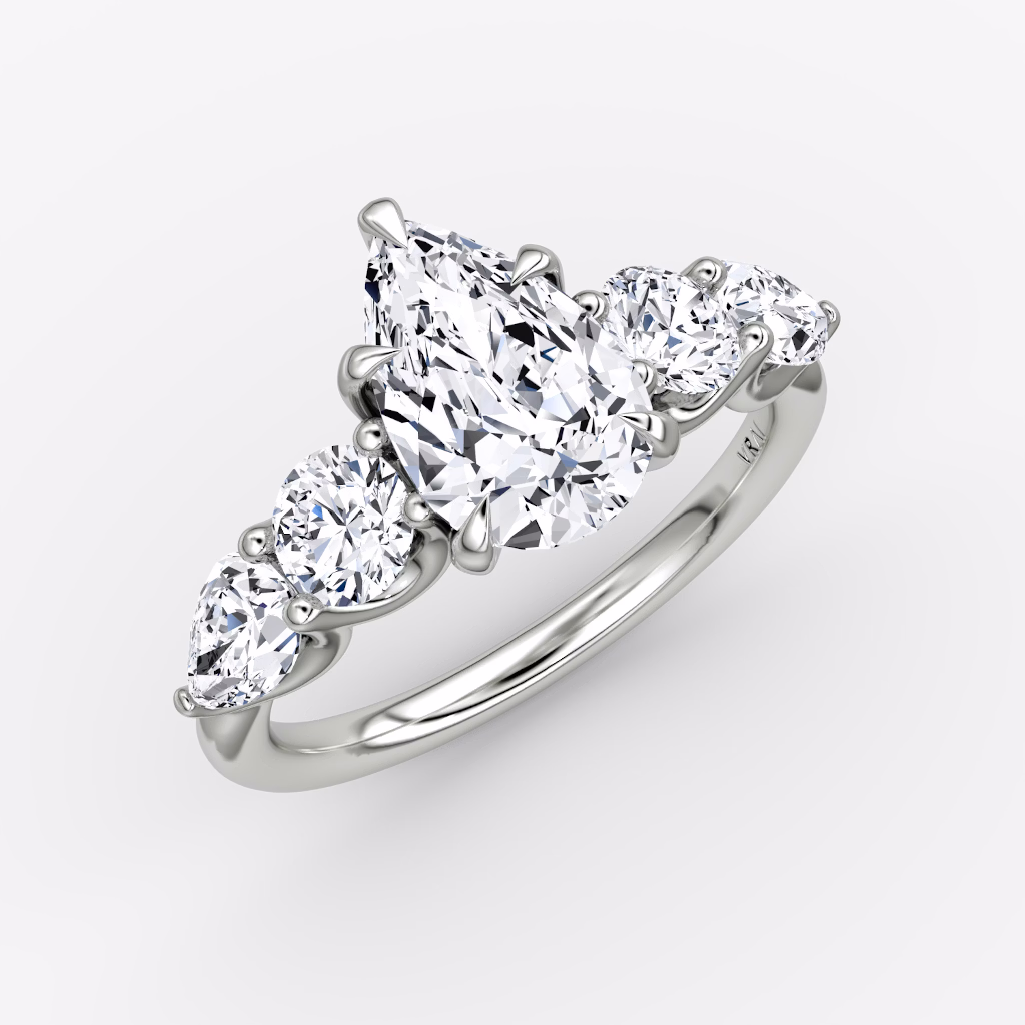 The Mixed Shape | Pear | 18k | White Gold | bandAccent: Plain | sideStoneOrientation: horizontal | sideStoneShape: Round Brilliant and Pear | diamondOrientation: vertical | caratWeight: other